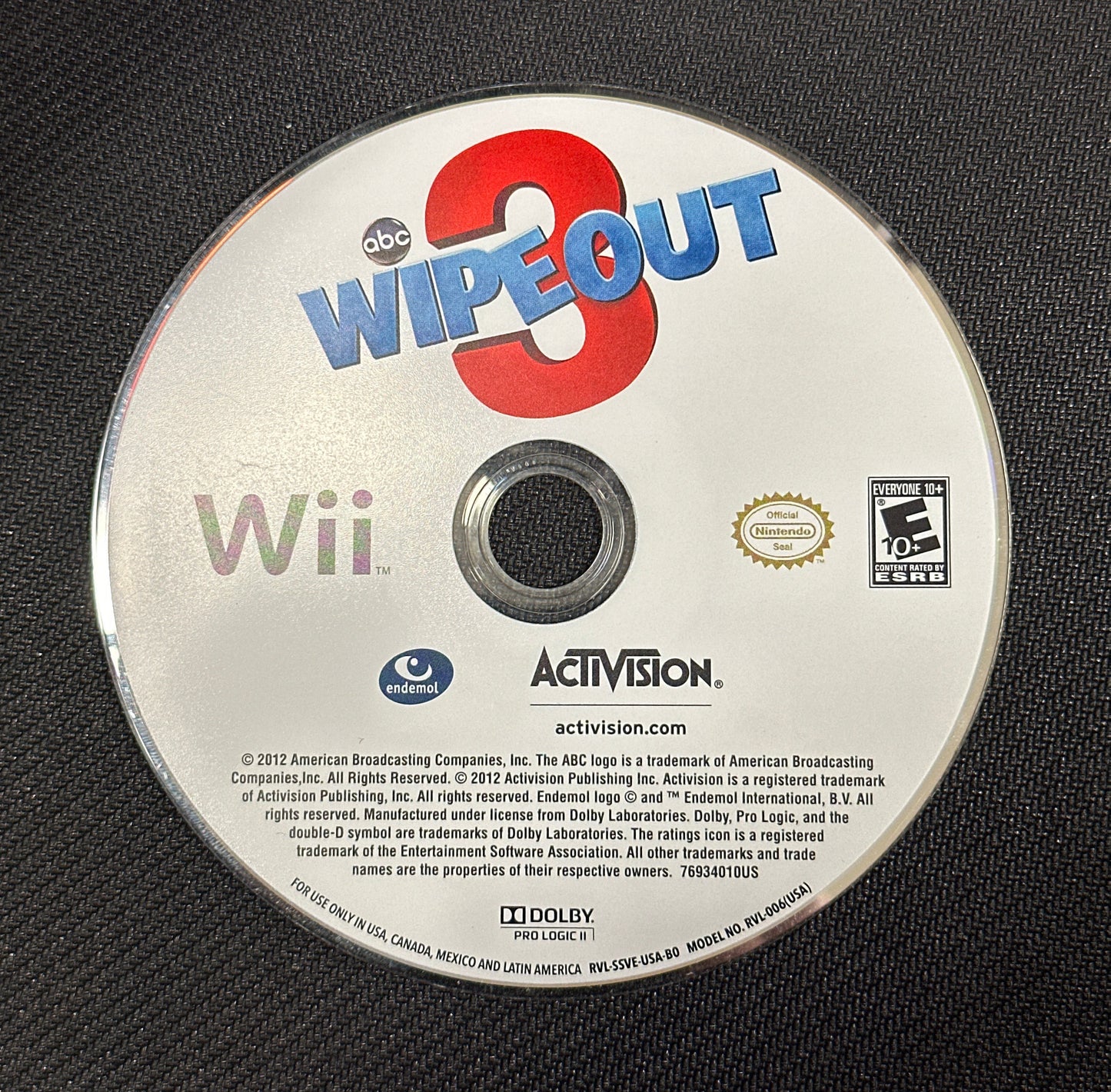 Wii game disc with 'Wipe Out' and Activision branding on a black background
