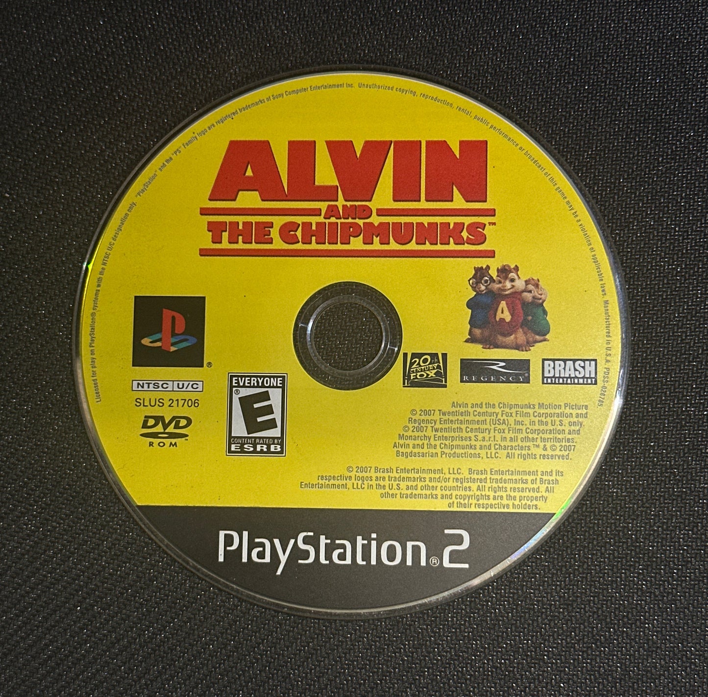 PlayStation 2 game disc for 'Alvin and the Chipmunks' on a black textured background
