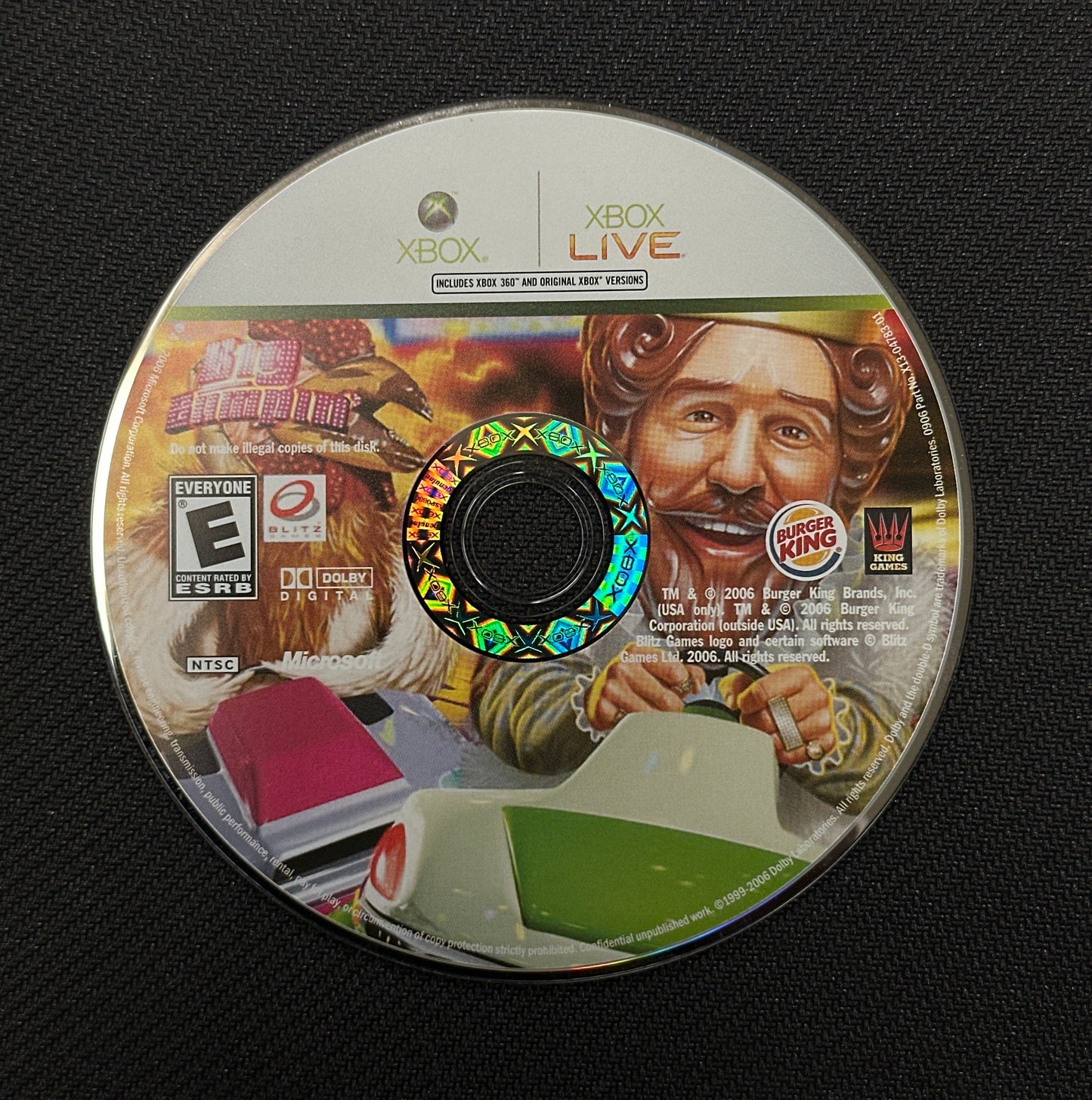 Game disc with a character design on a black background