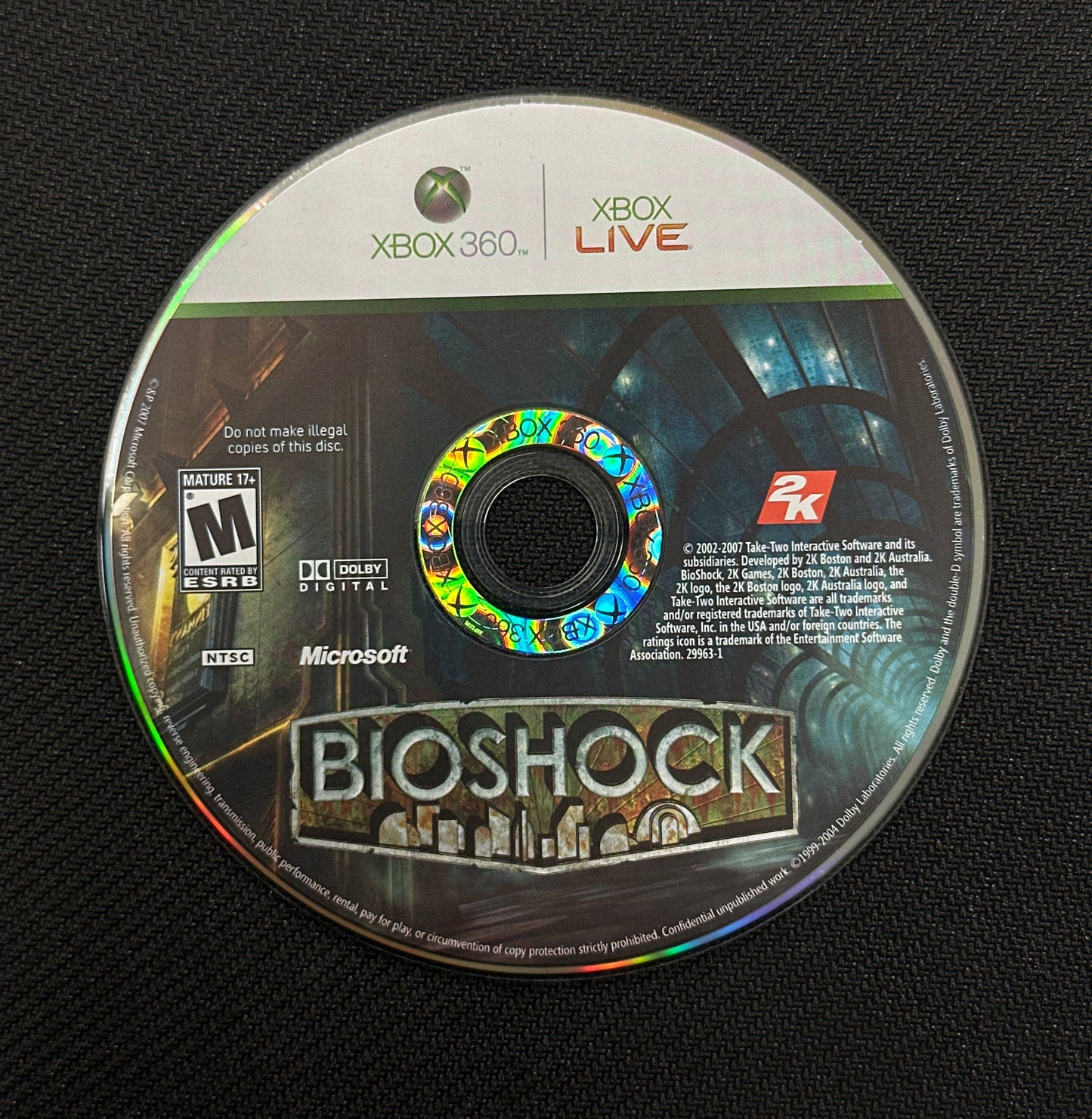 Game disc for 'BioShock' on a black background
