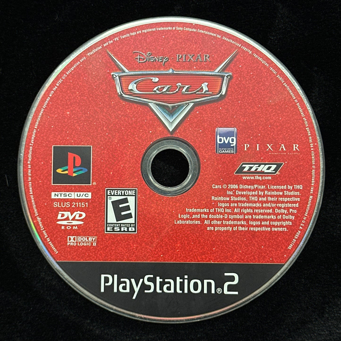 PlayStation 2 game disc for 'Cars' on a black background