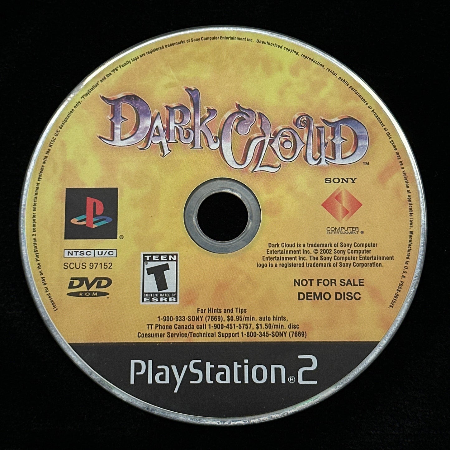 PlayStation 2 game disc labeled 'Dark Cloud' on a black background