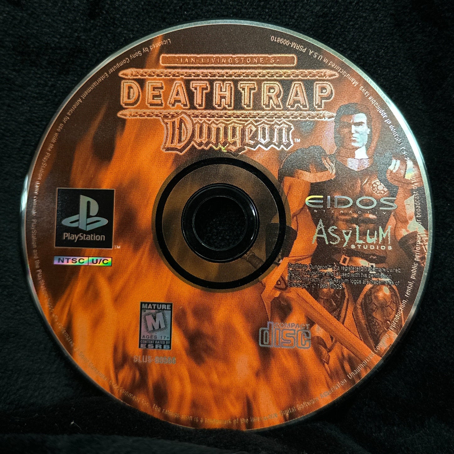 Game disc with 'Deathtrap Dungeon' branding on a black background