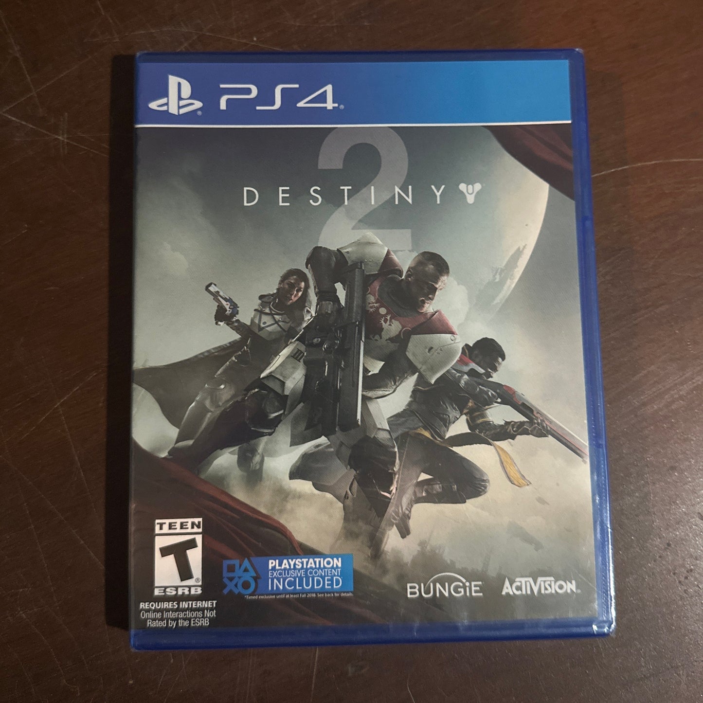 Video game case for 'Destiny 2' on a wooden surface