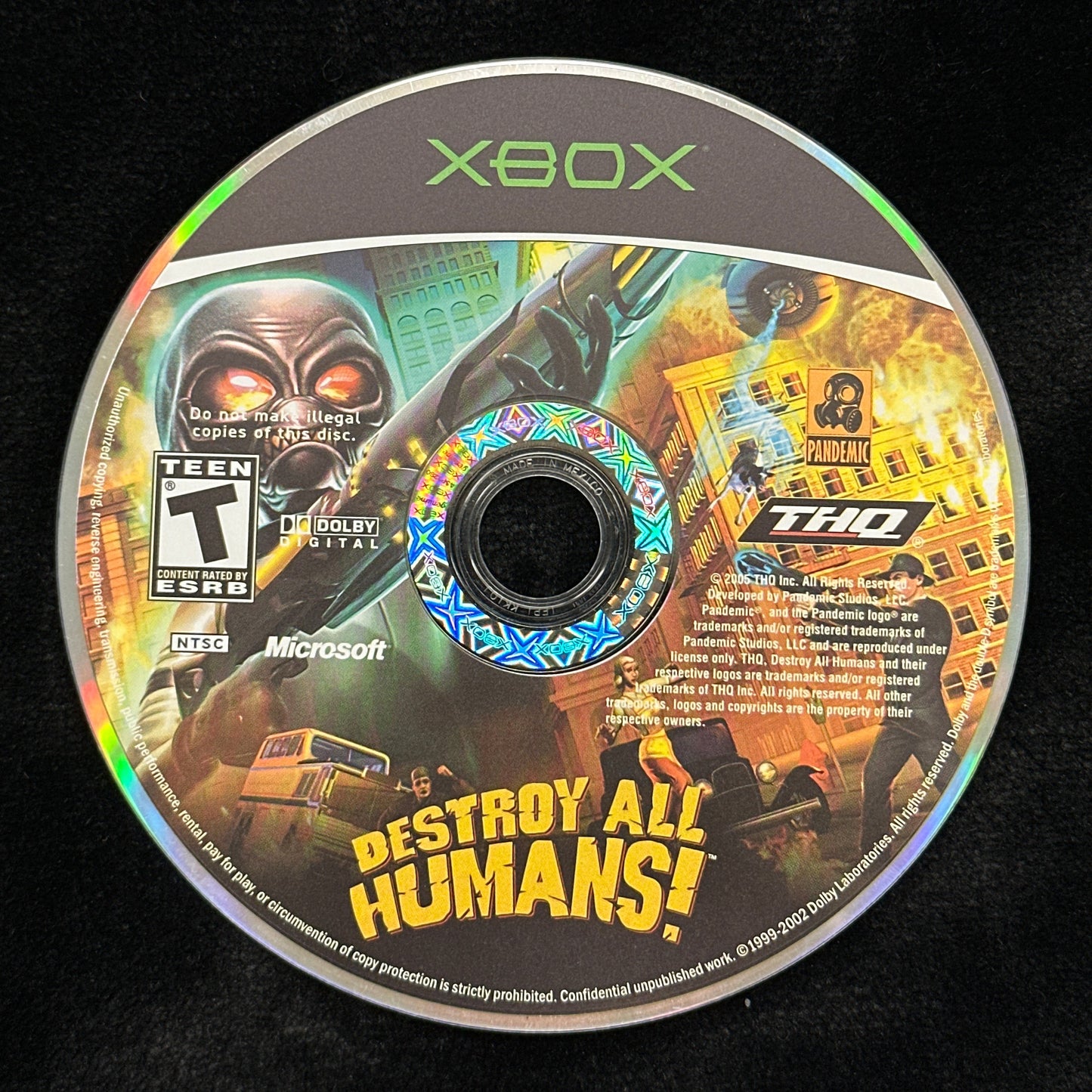 Xbox game disc with 'Destoy All Humans!' text on a black background