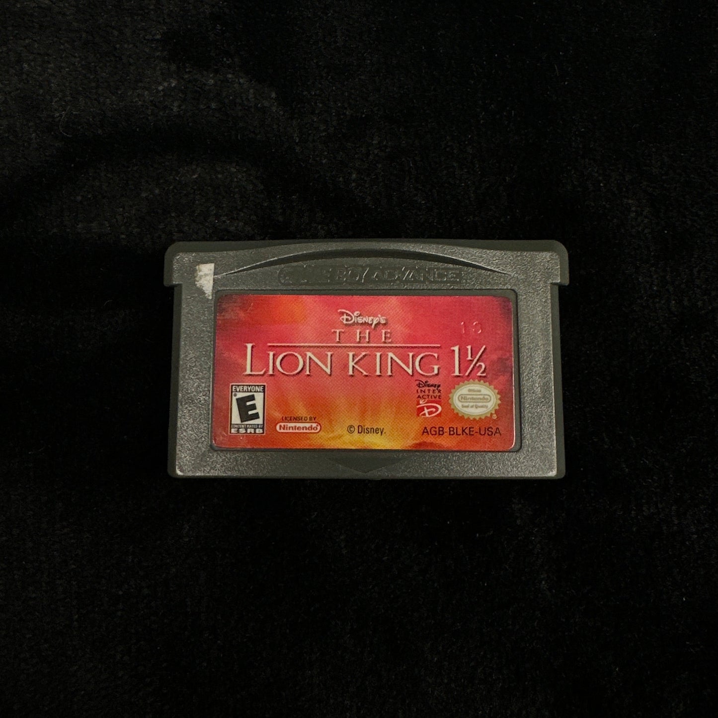 Game cartridge with a red label on a black background