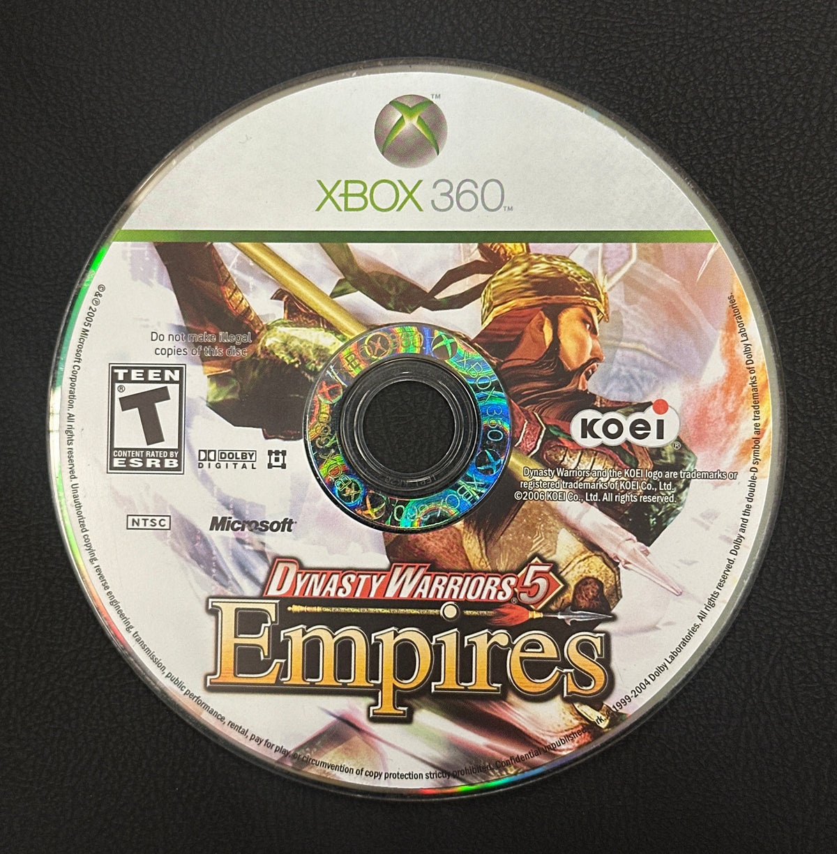 Game disc for 'Dynasty Warriors 5 Empires' on a black background