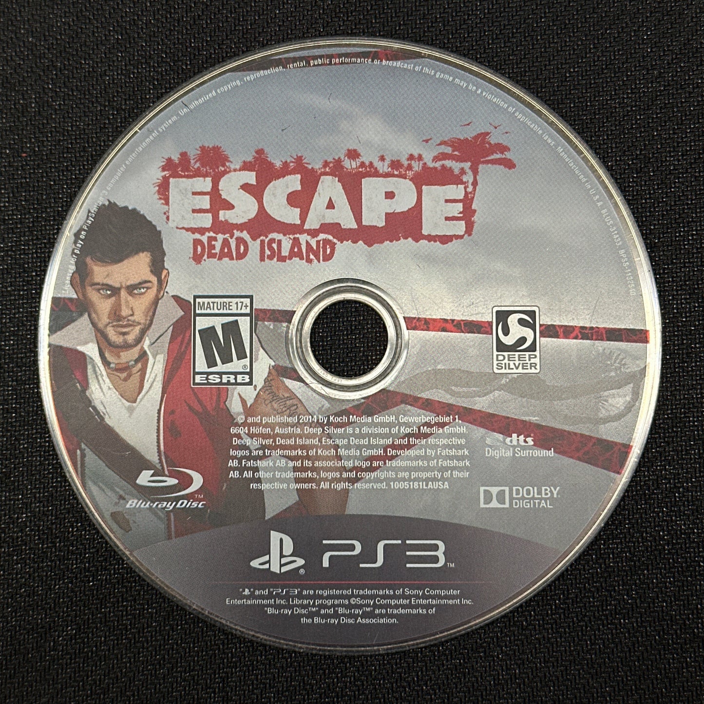 Game disc for 'Escape Dead Island' on a black background