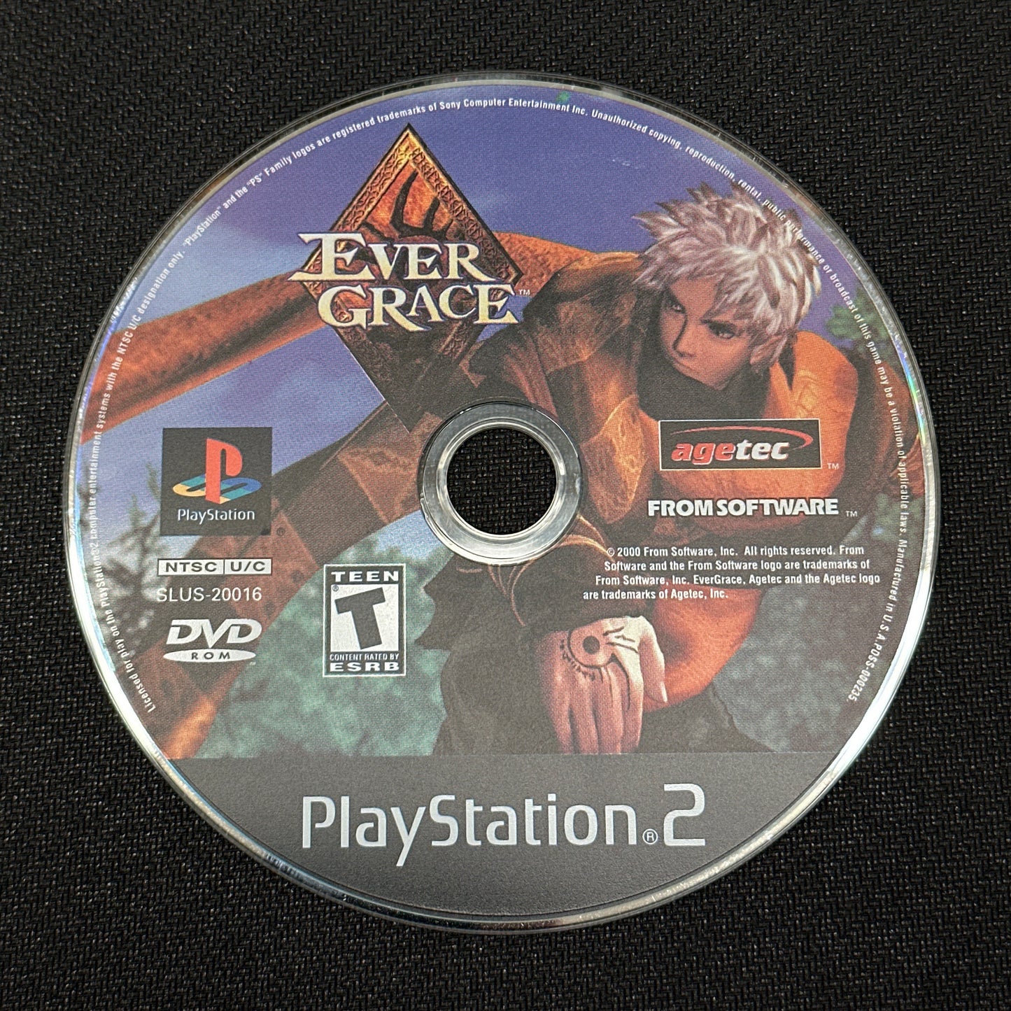 PlayStation 2 game disc labeled 'Ever Grace' on a black surface