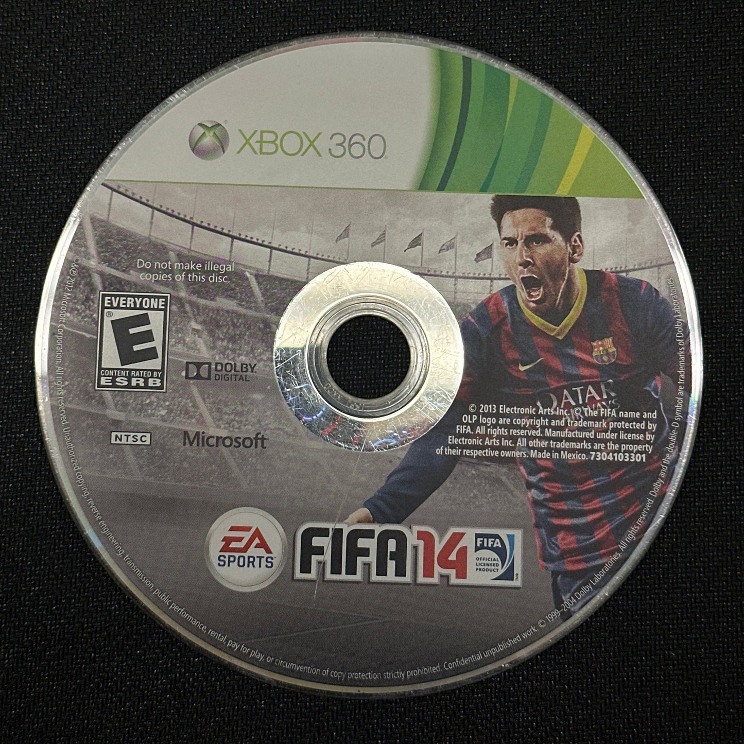 FIFA 14 game disc for Xbox 360 on a black background