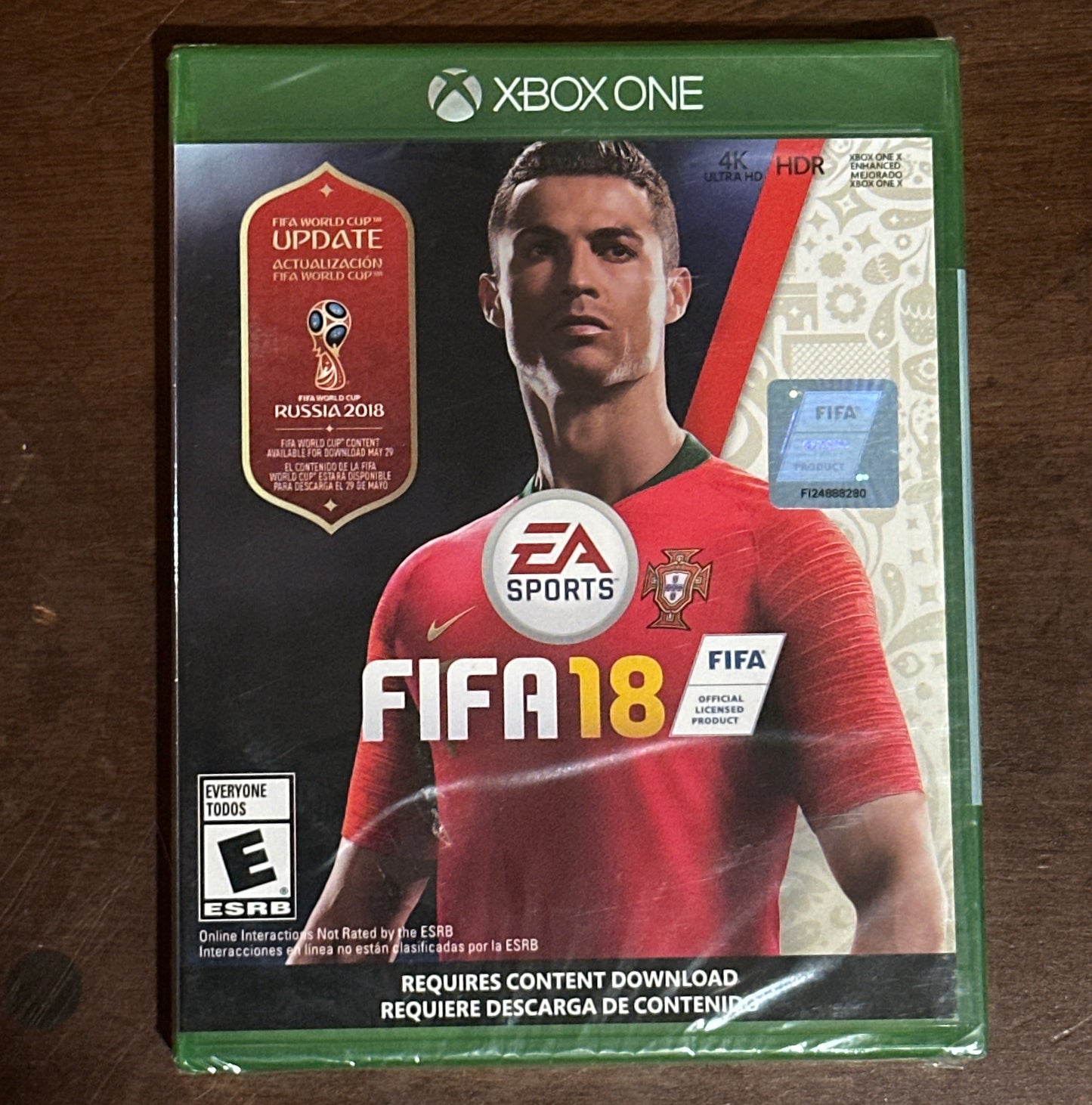 FIFA 18 video game case for Xbox One on a wooden surface