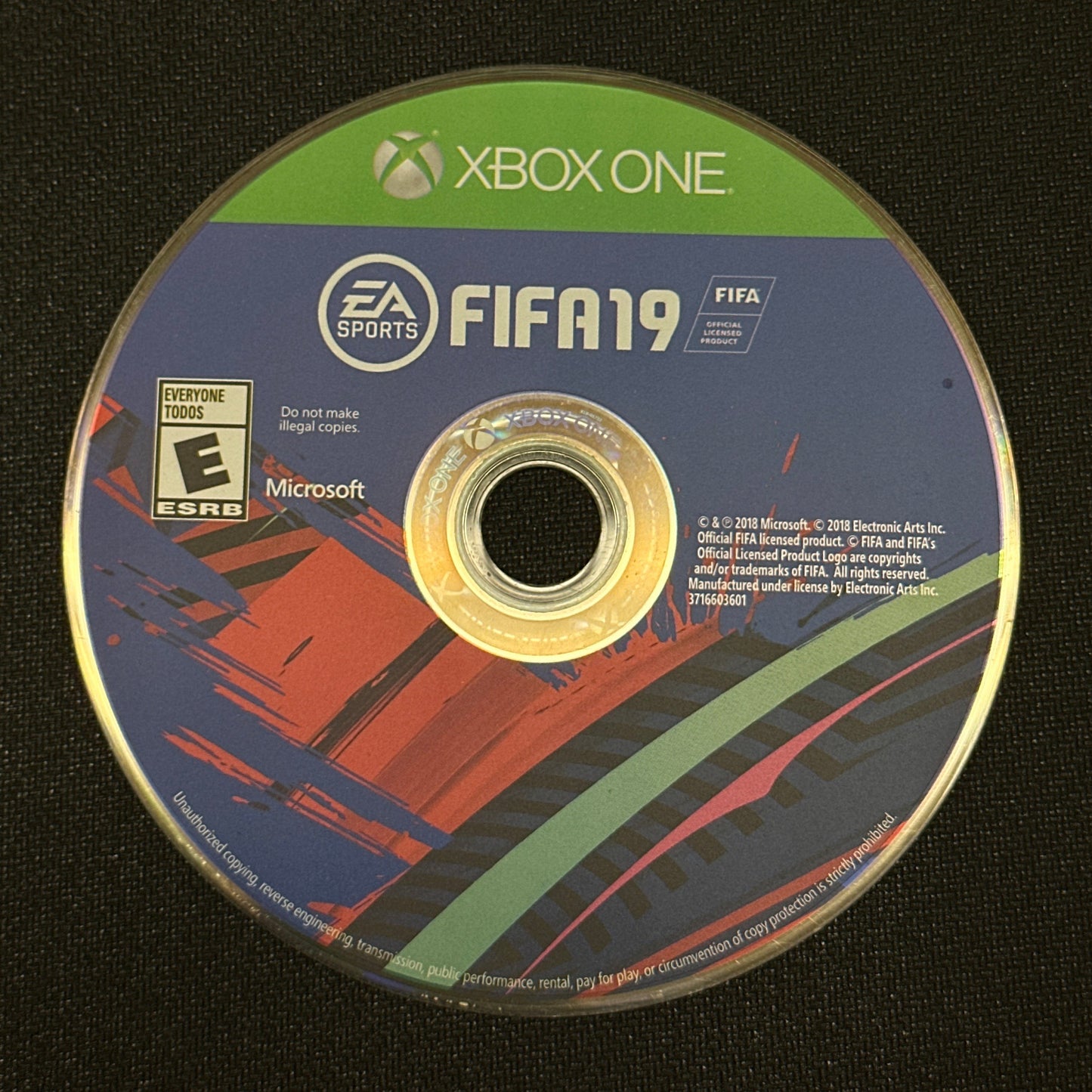 FIFA 19 Xbox One game disc on a black background