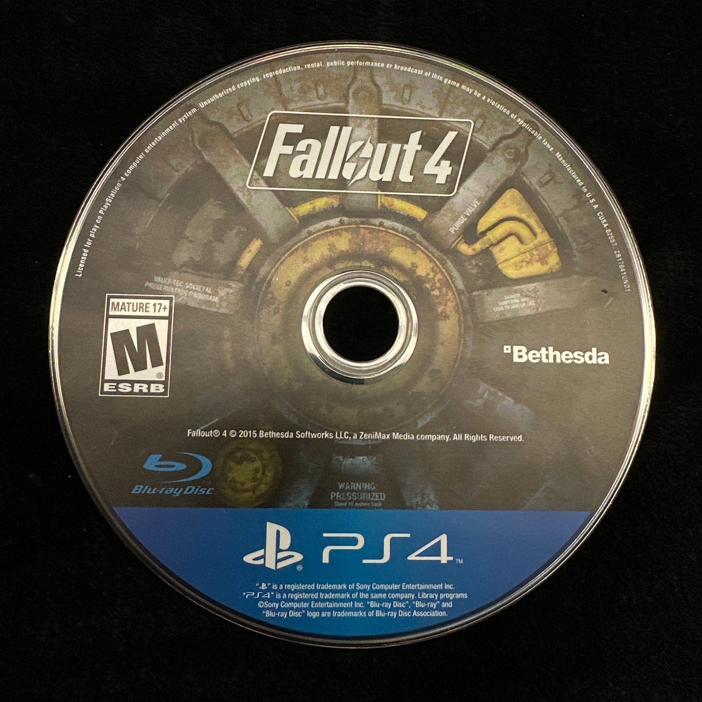 Game disc for 'Fallout 4' on a black background