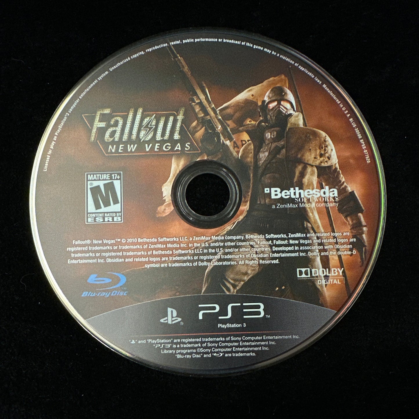Game disc for 'Fallout: New Vegas' on a black background