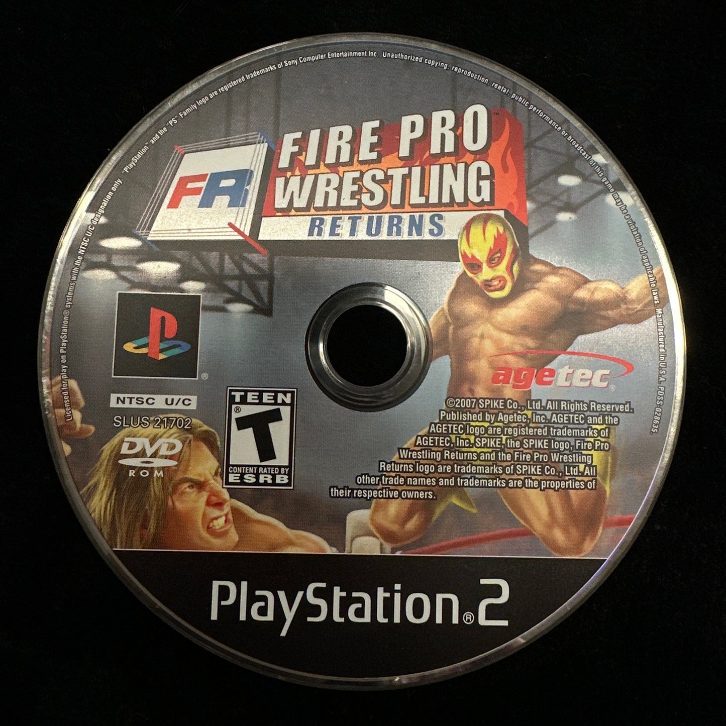 PlayStation 2 game disc for 'Fire Pro Wrestling Returns' on a black background