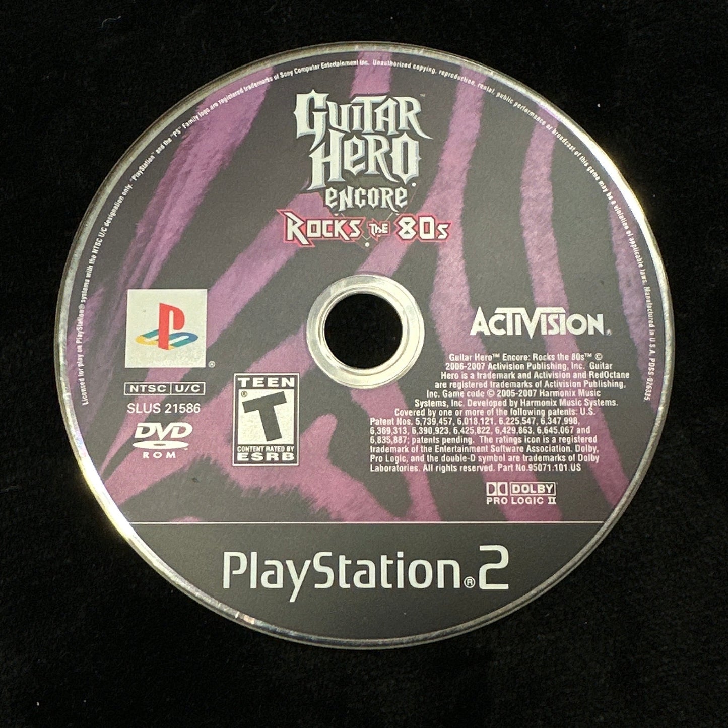 Guitar Hero game disc for PlayStation 2 on a black background