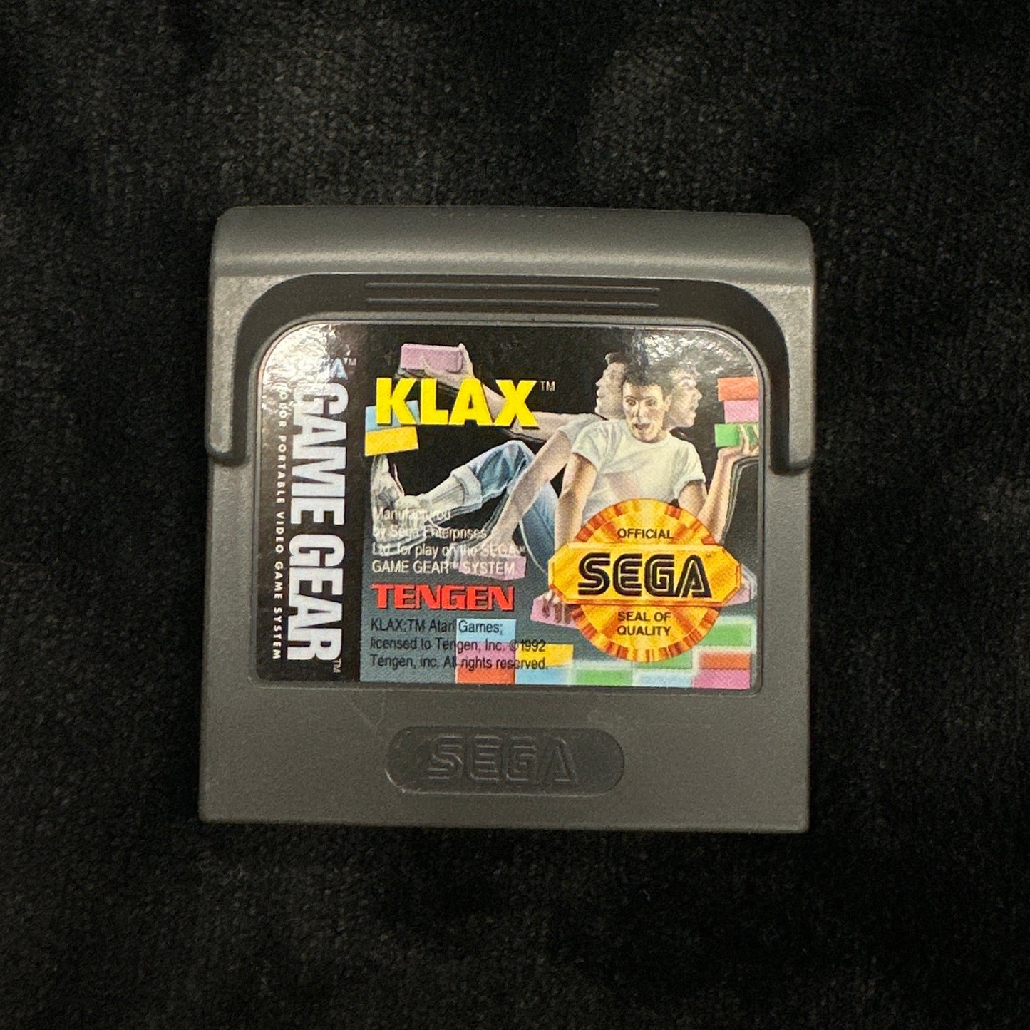 Sega Game Gear cartridge on a dark background