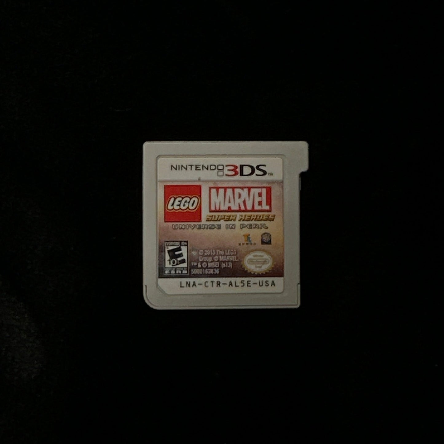Nintendo 3DS game card with LEGO Marvel branding on a black background