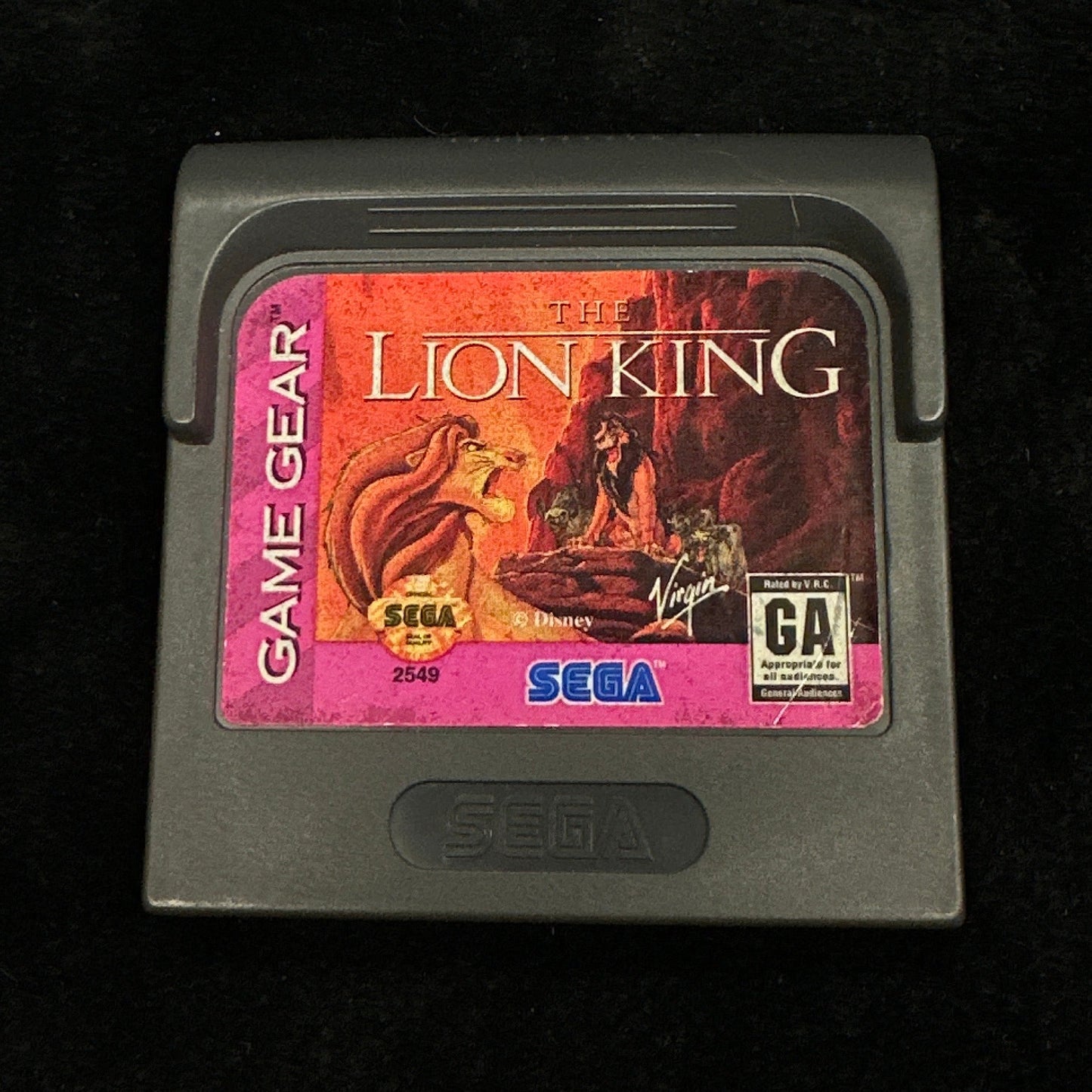 Sega game cartridge for 'The Lion King' on a dark background