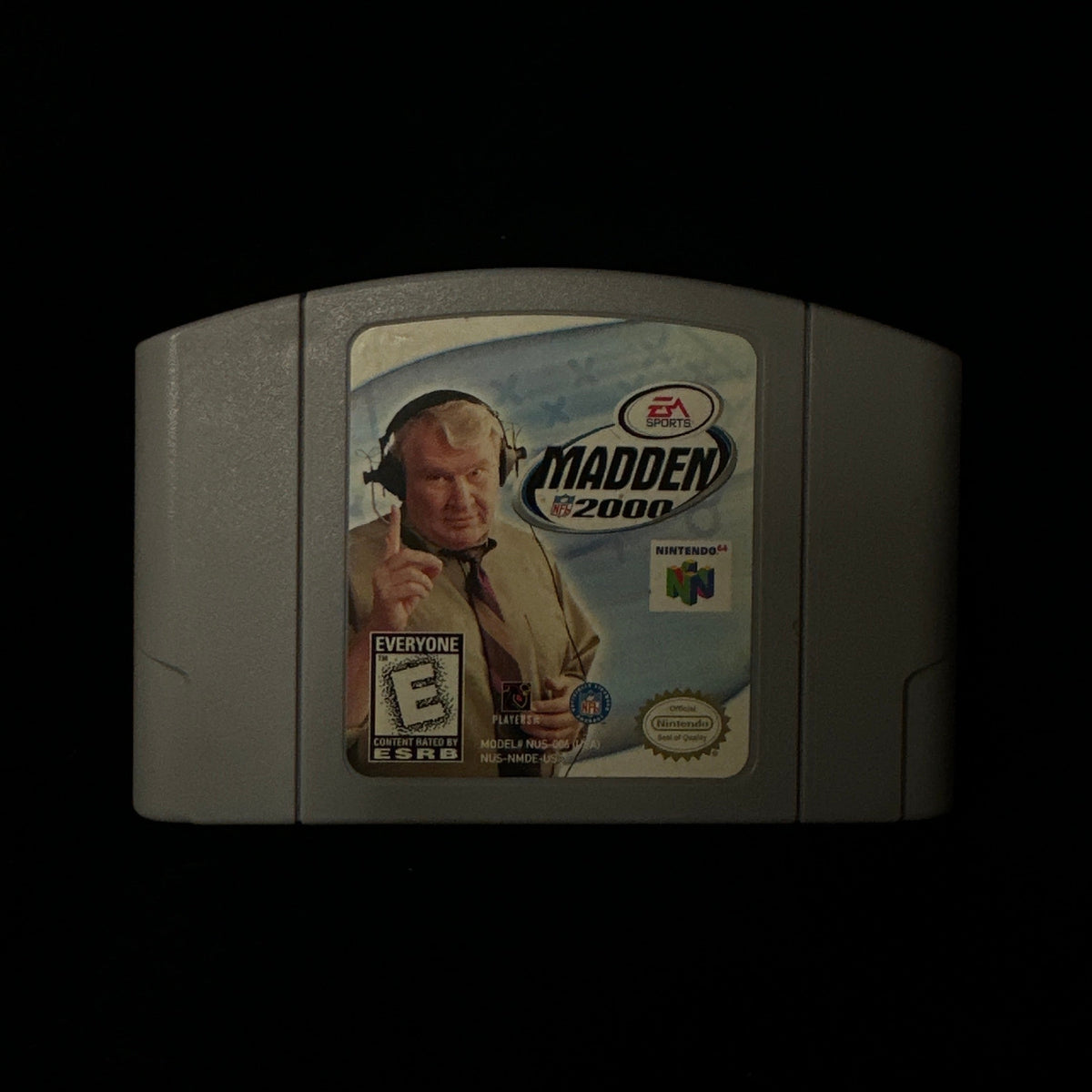 A Nintendo 64 Madden 2000 video game cartridge shown against a dark black background.