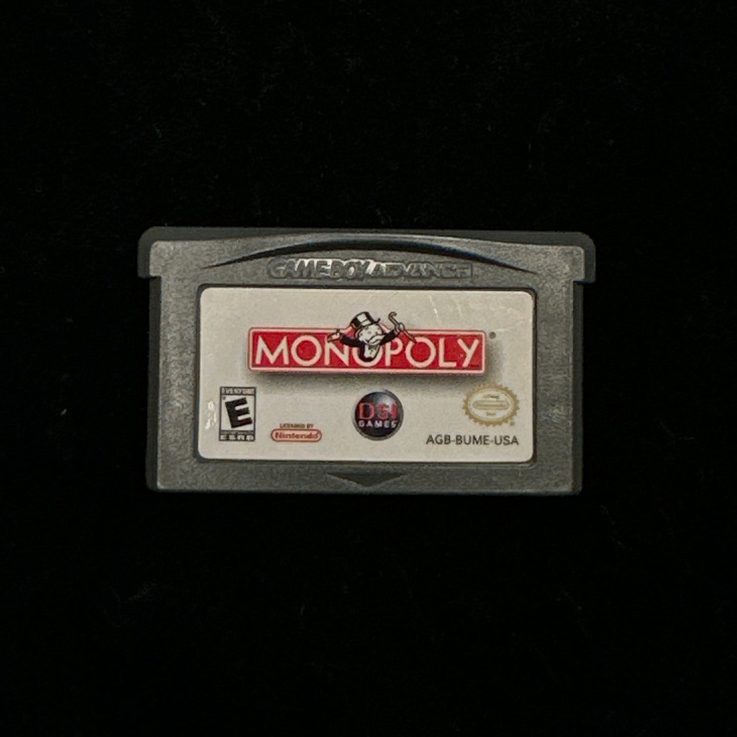 Monopoly game cartridge on a black background
