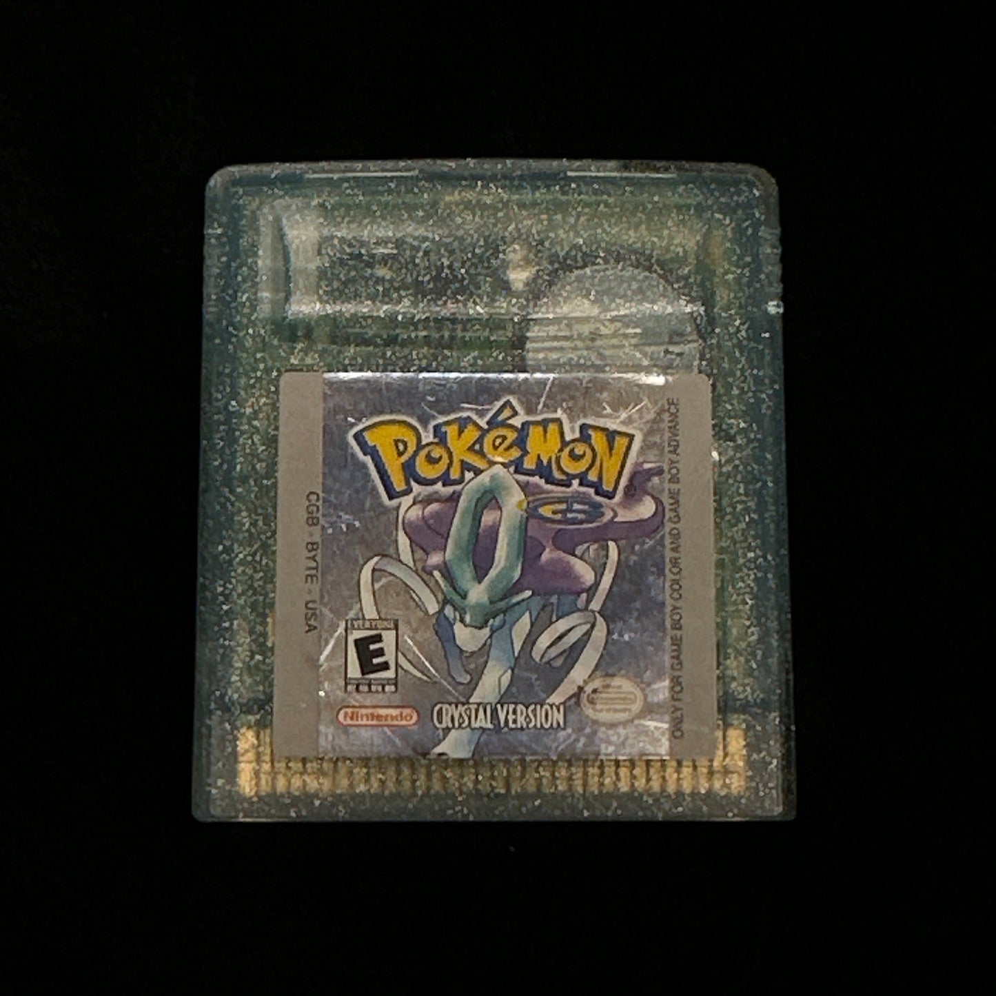 Pokémon game cartridge on a black background