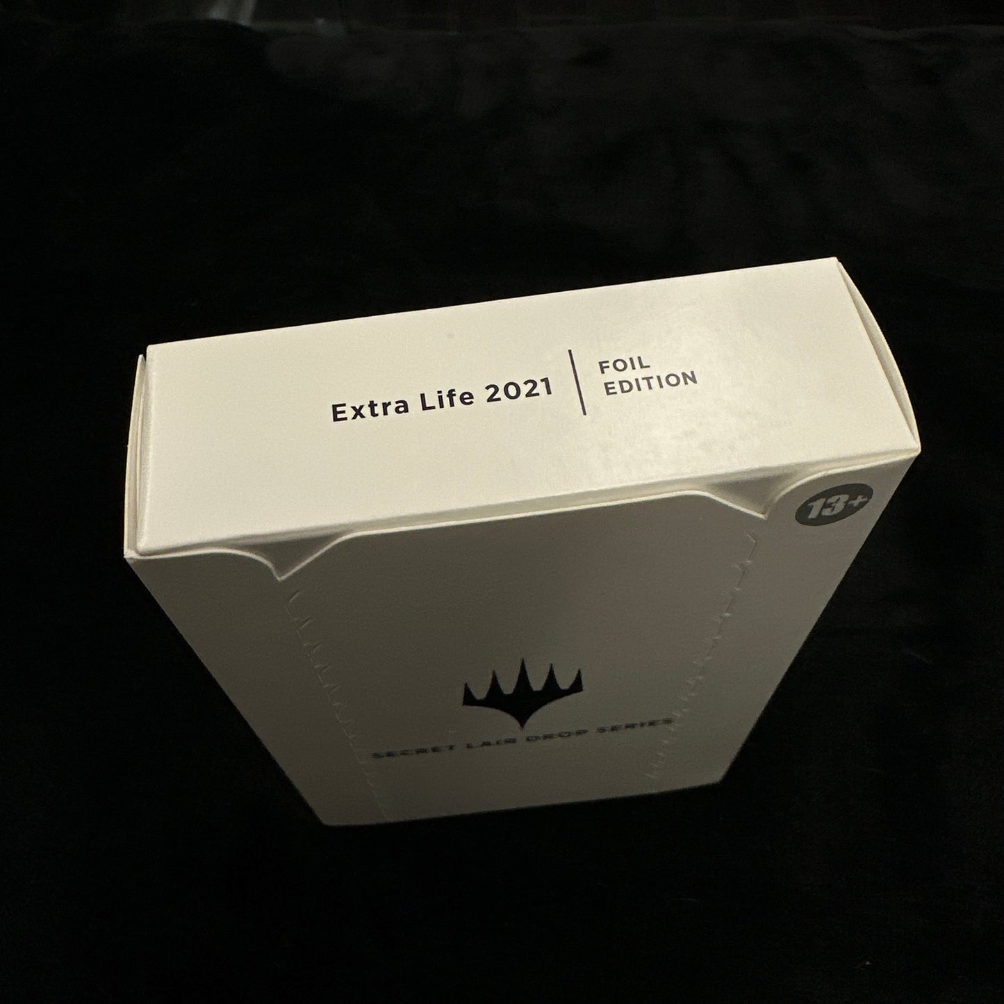 Box labeled 'Extra Life 2021' on a dark background