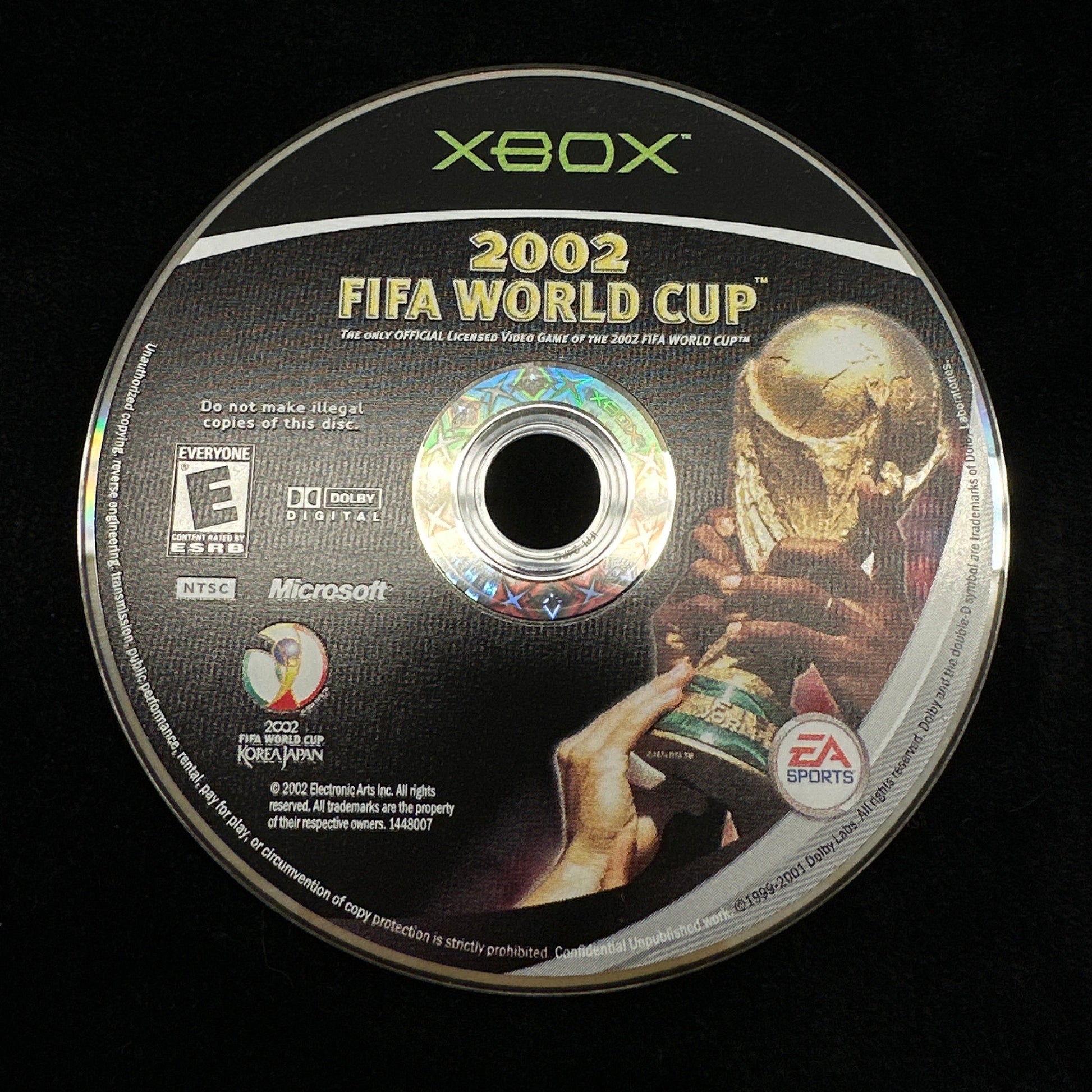 Xbox 2002 FIFA World Cup game disc on a black background