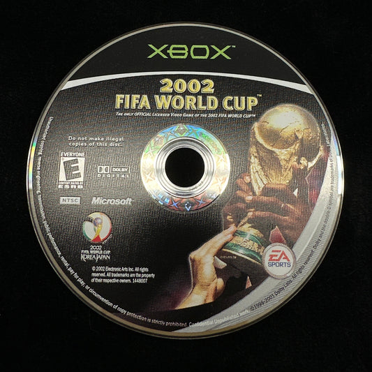 Xbox 2002 FIFA World Cup game disc on a black background