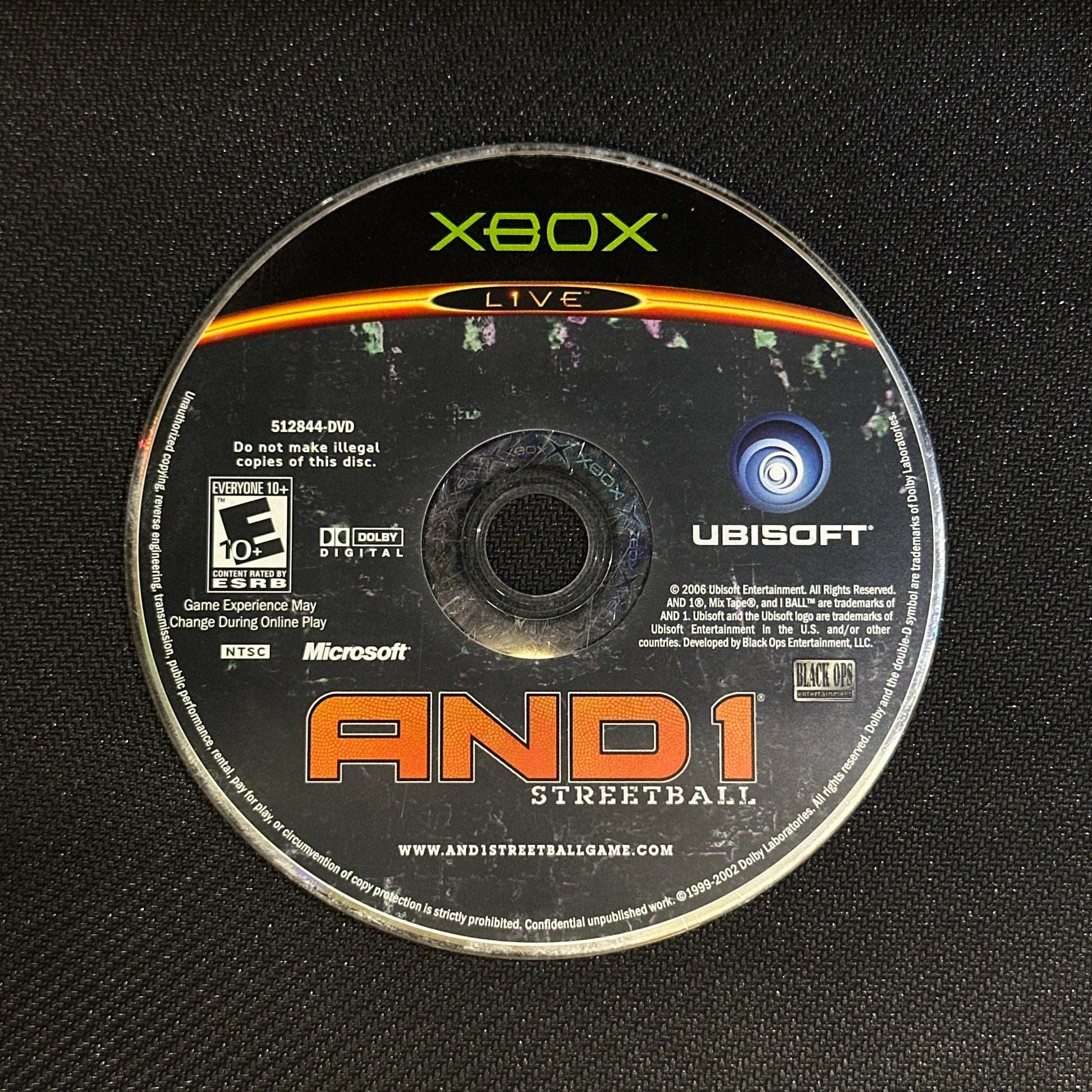 Game disc for 'AND1 Streetball' on an Xbox console with Ubisoft branding.
