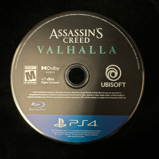 A PlayStation 4 game disc for Assassin's Creed Valhalla, featuring the Ubisoft and Sony PlayStation branding, photographed on a black background.