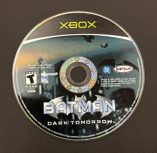 Game disc for 'Batman: Dark Tomorrow' on Xbox with branding and game title visible.