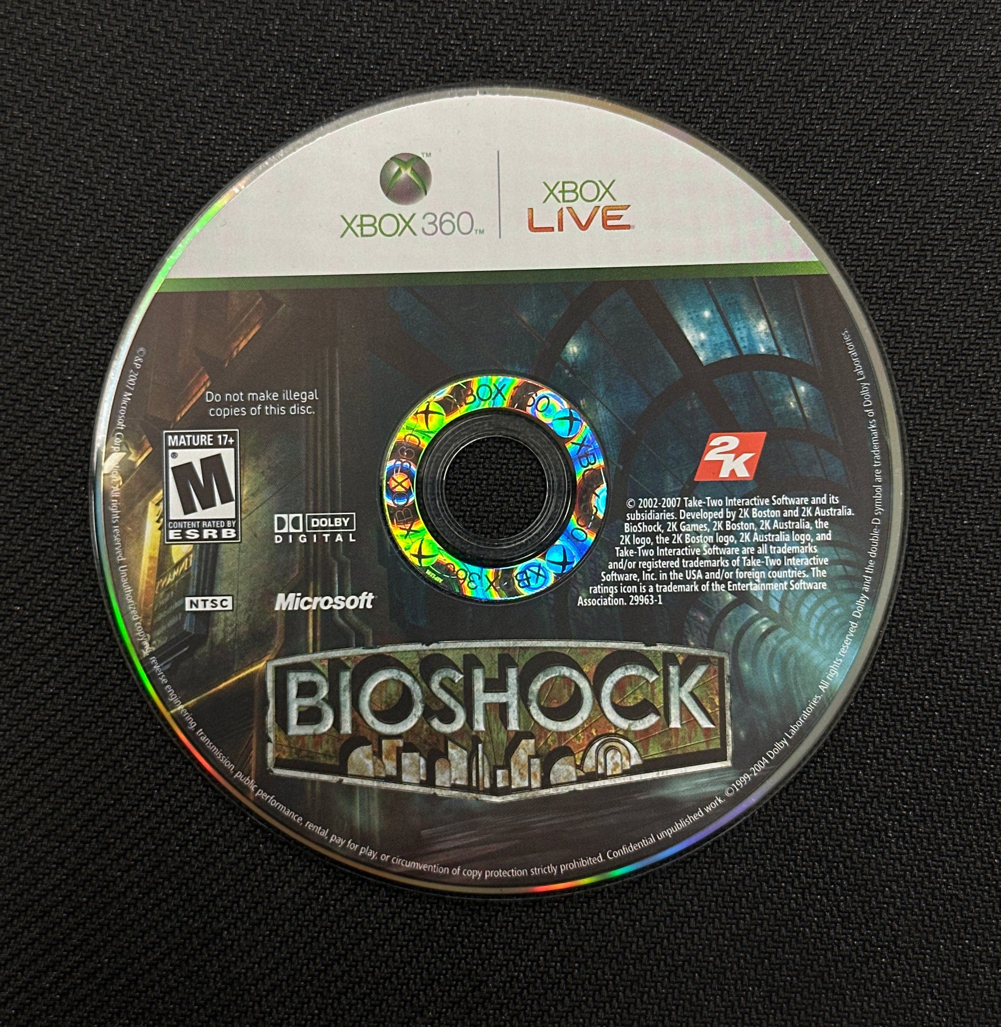 Game disc for 'BioShock' on a black background