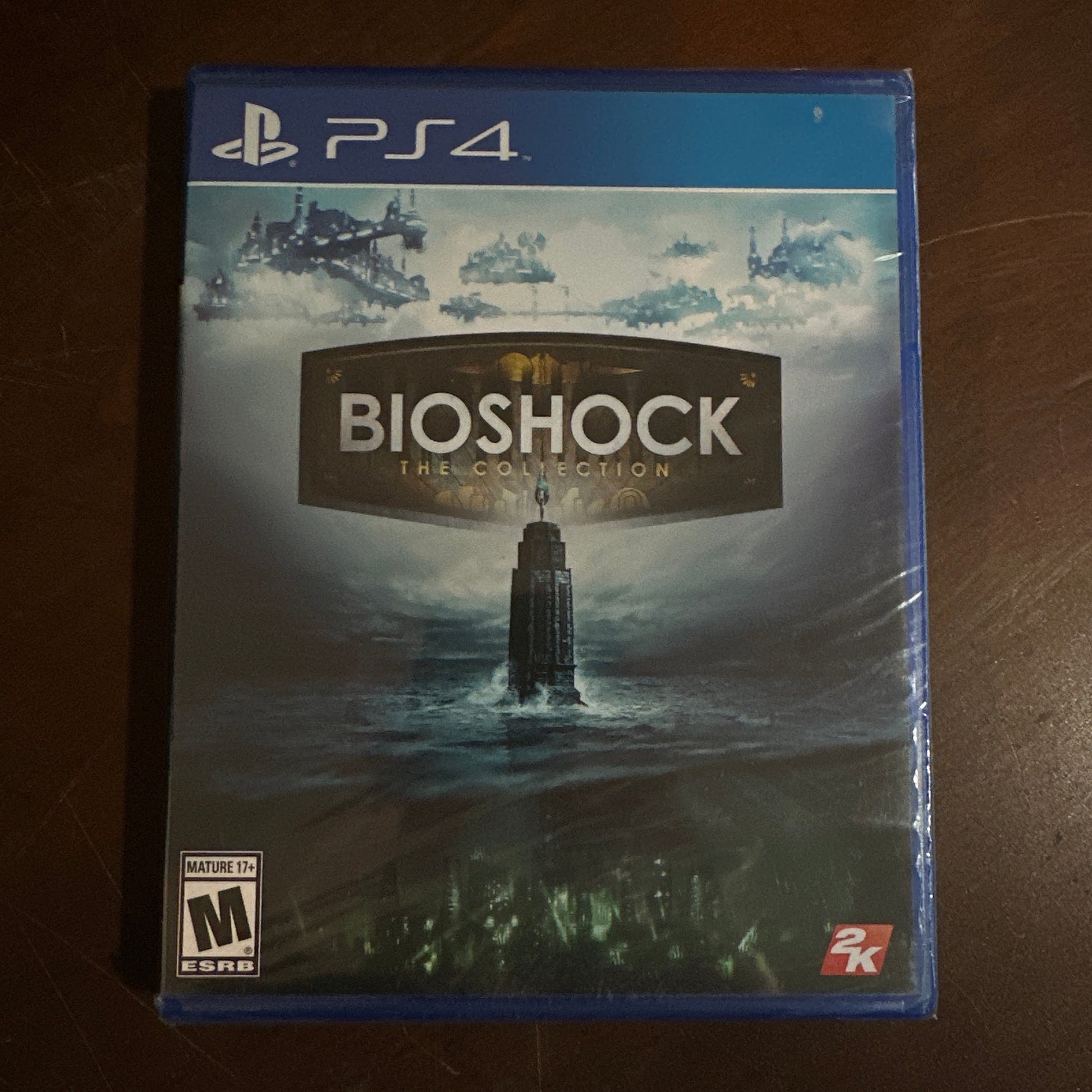 BioShock game for PS4 on a wooden surface