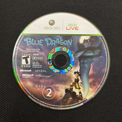Game disc for 'Blue Dragon' on Xbox 360 with cover on a black background