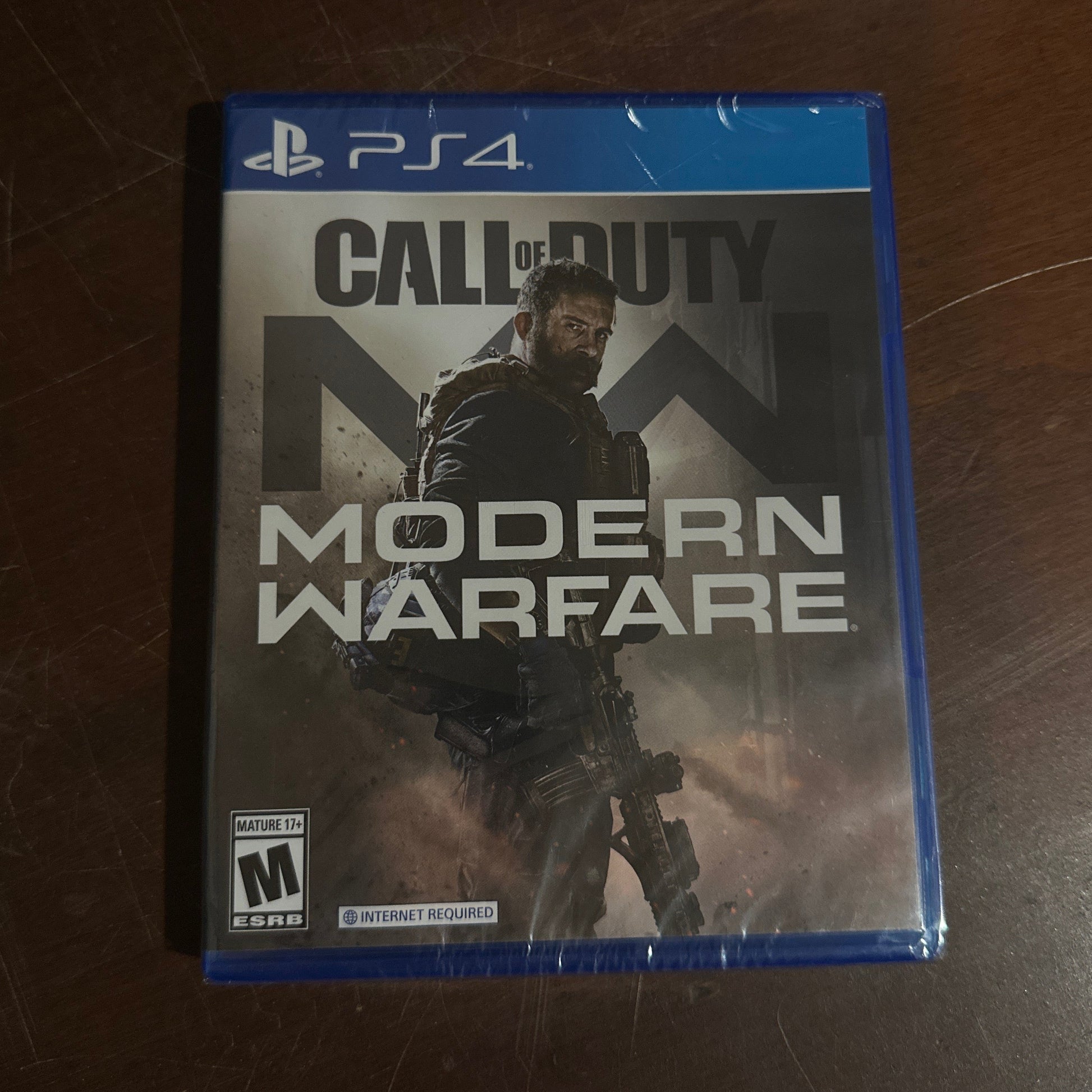 Call of Duty: Modern Warfare game case on a wooden surface