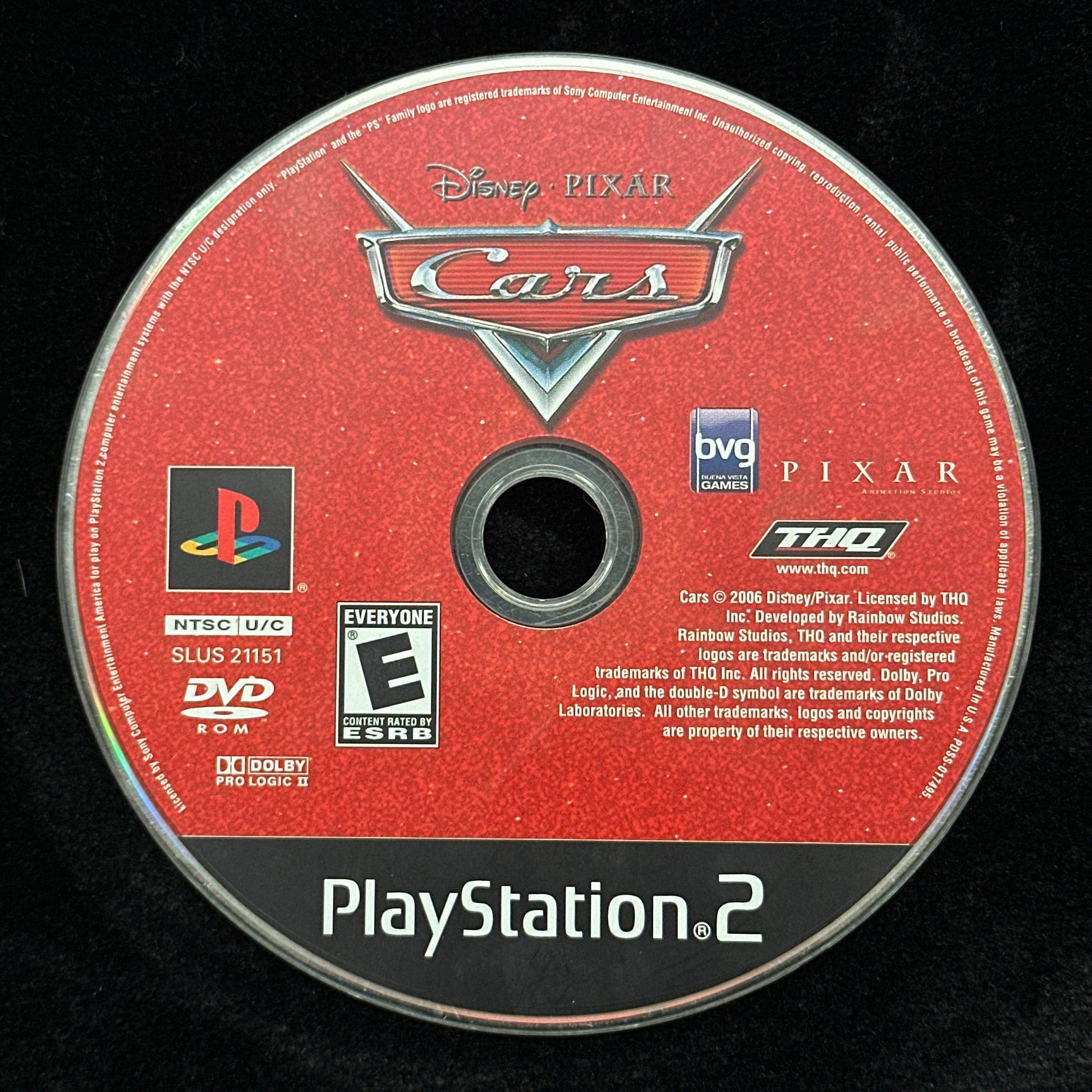 PlayStation 2 game disc for 'Cars' on a black background