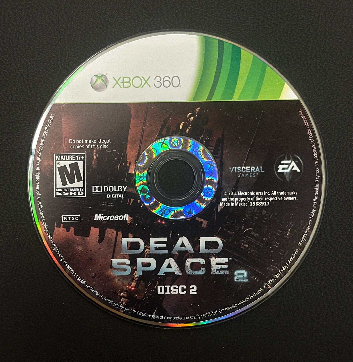 Dead Space 2 game disc for Xbox 360 on a black background