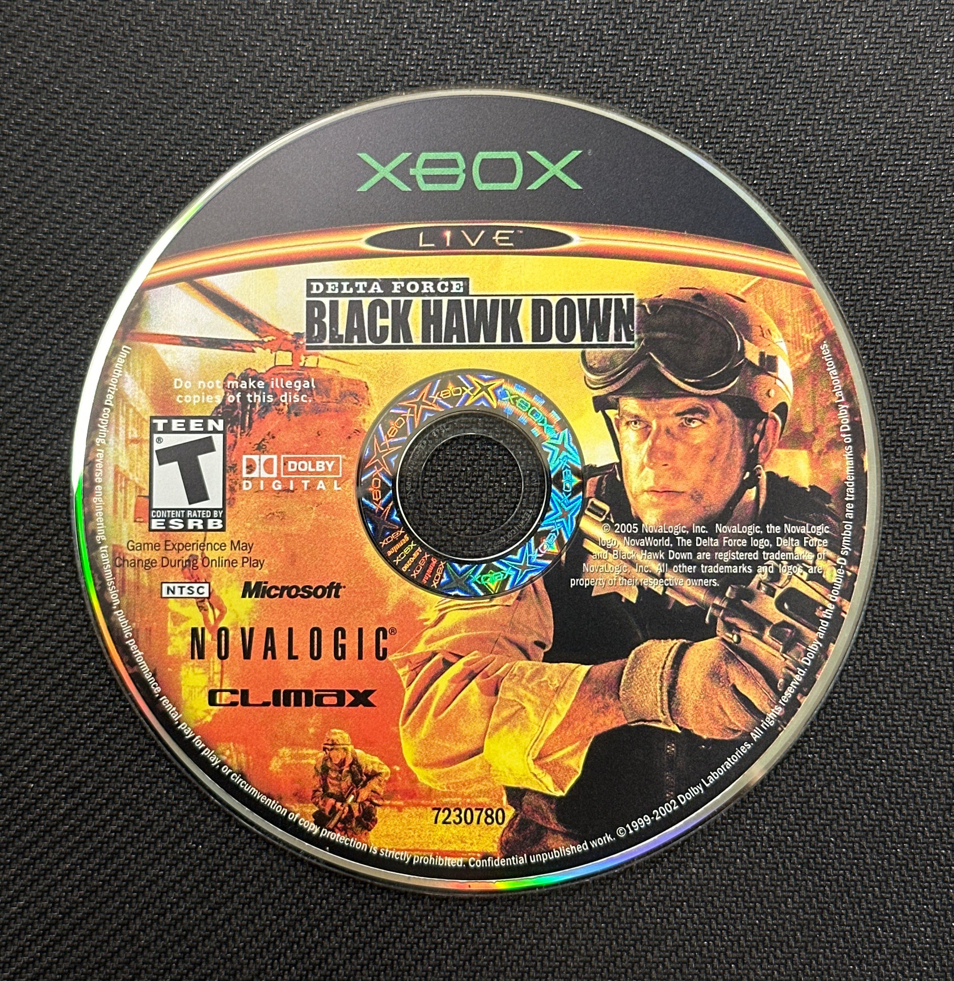 Game disc for 'Black Hawk Down' on Xbox with visible branding and graphics.