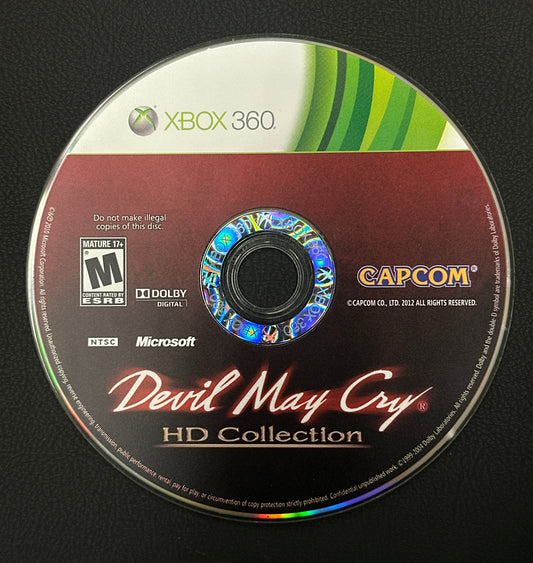 Game disc for 'Devil May Cry HD Collection' on Xbox 360 with Capcom branding.