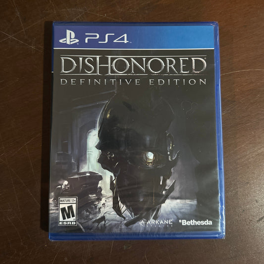 Game case for 'Dishonored: Definitive Edition' on a wooden surface