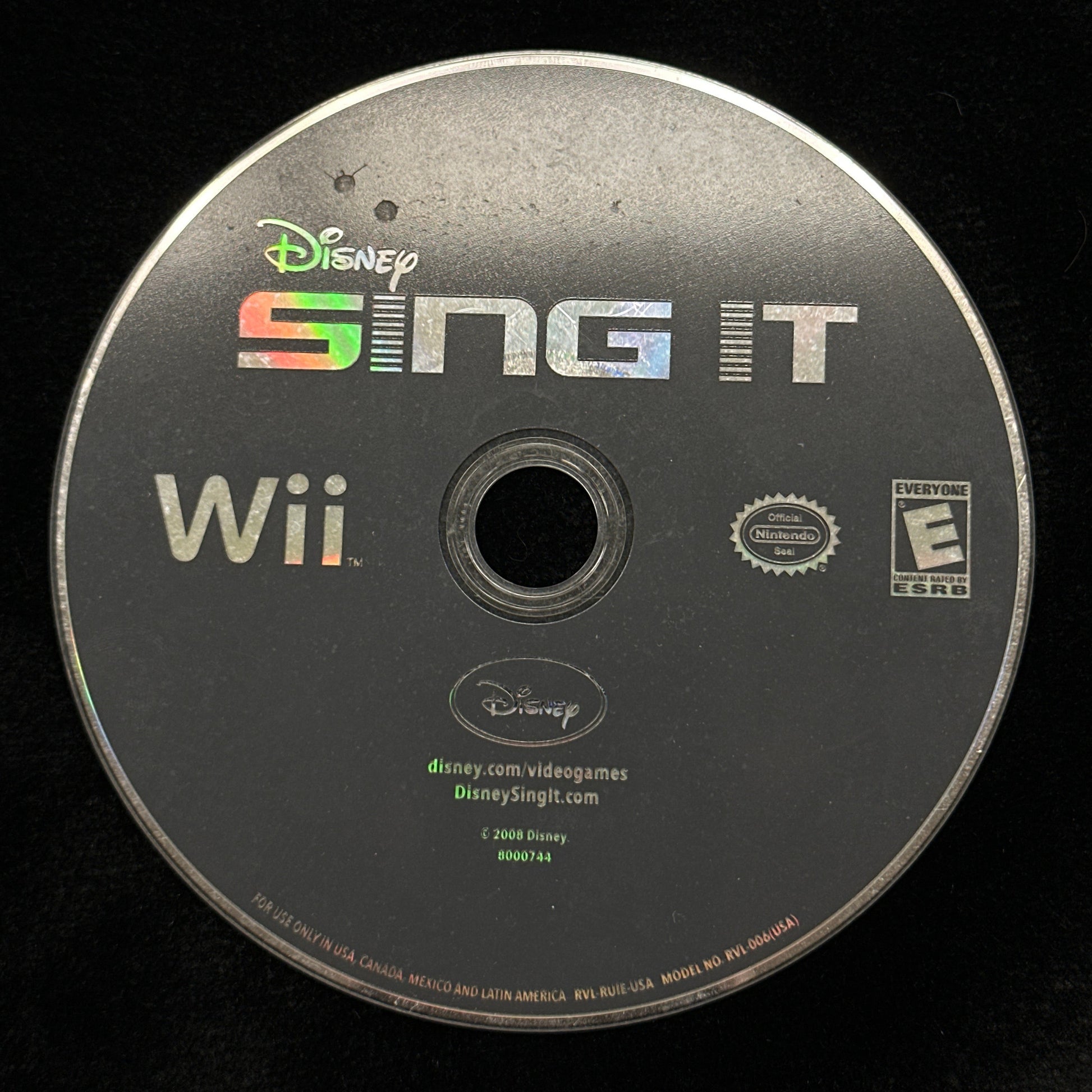 Wii game disc for 'Sing It' on a black background