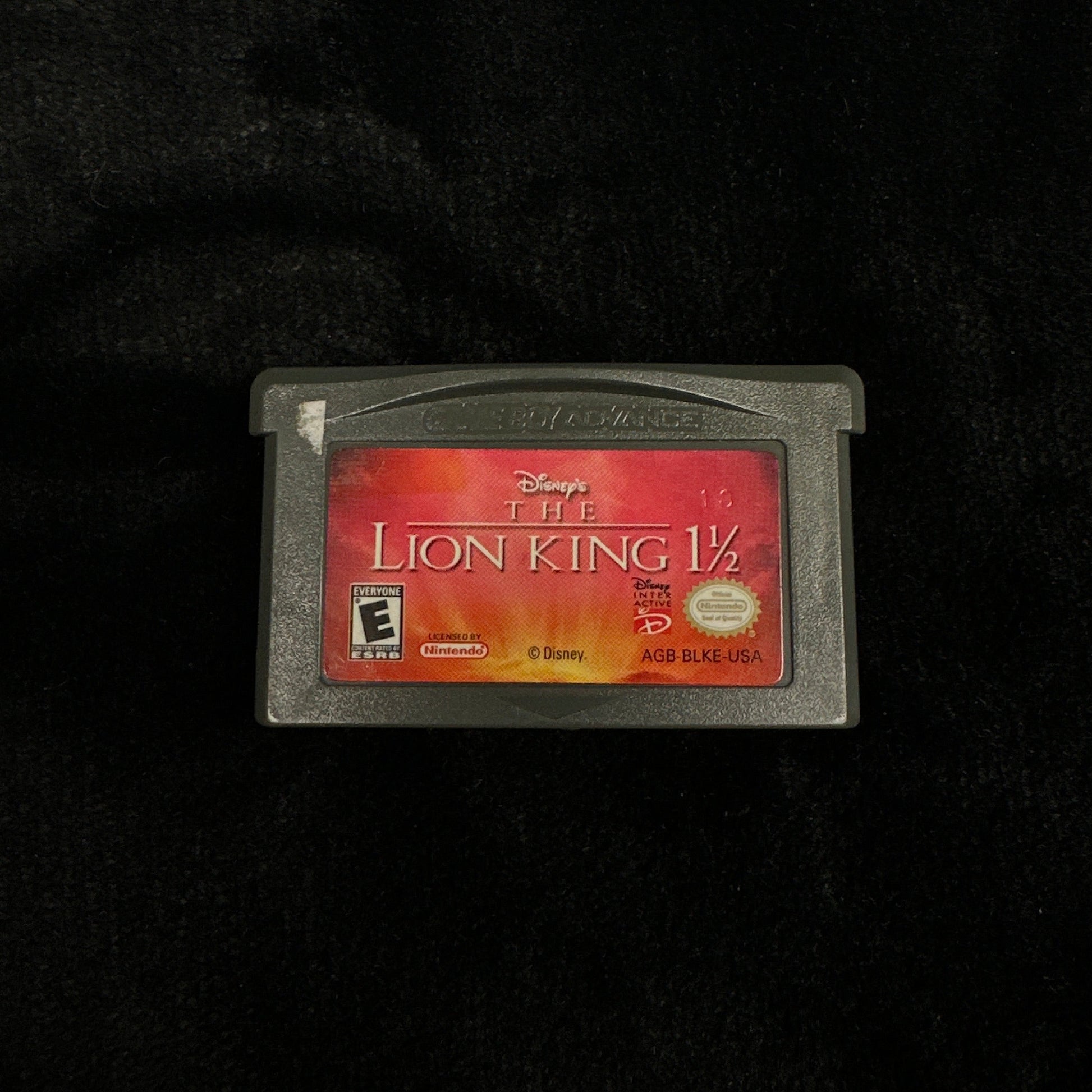 Game cartridge with a red label on a black background