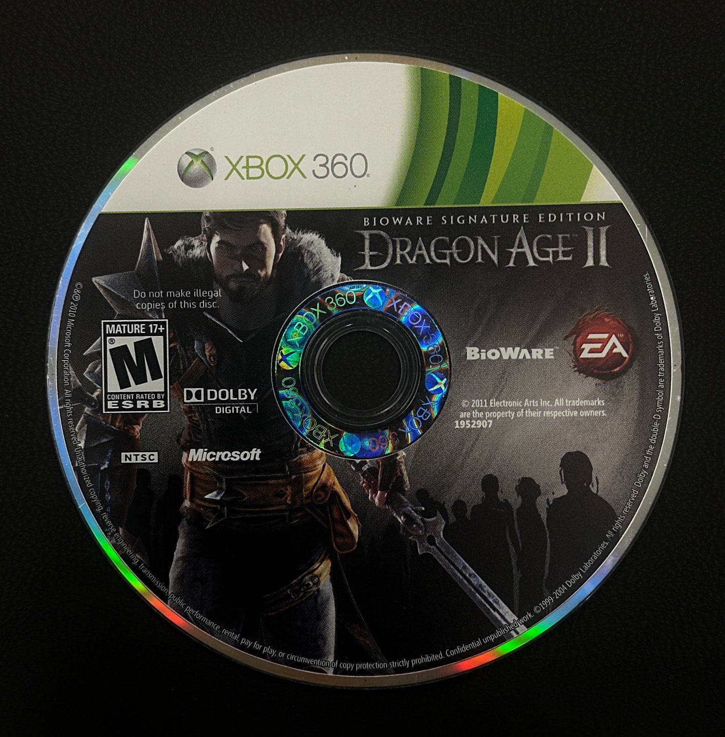 Dragon Age II game disc for Xbox 360 on a black background