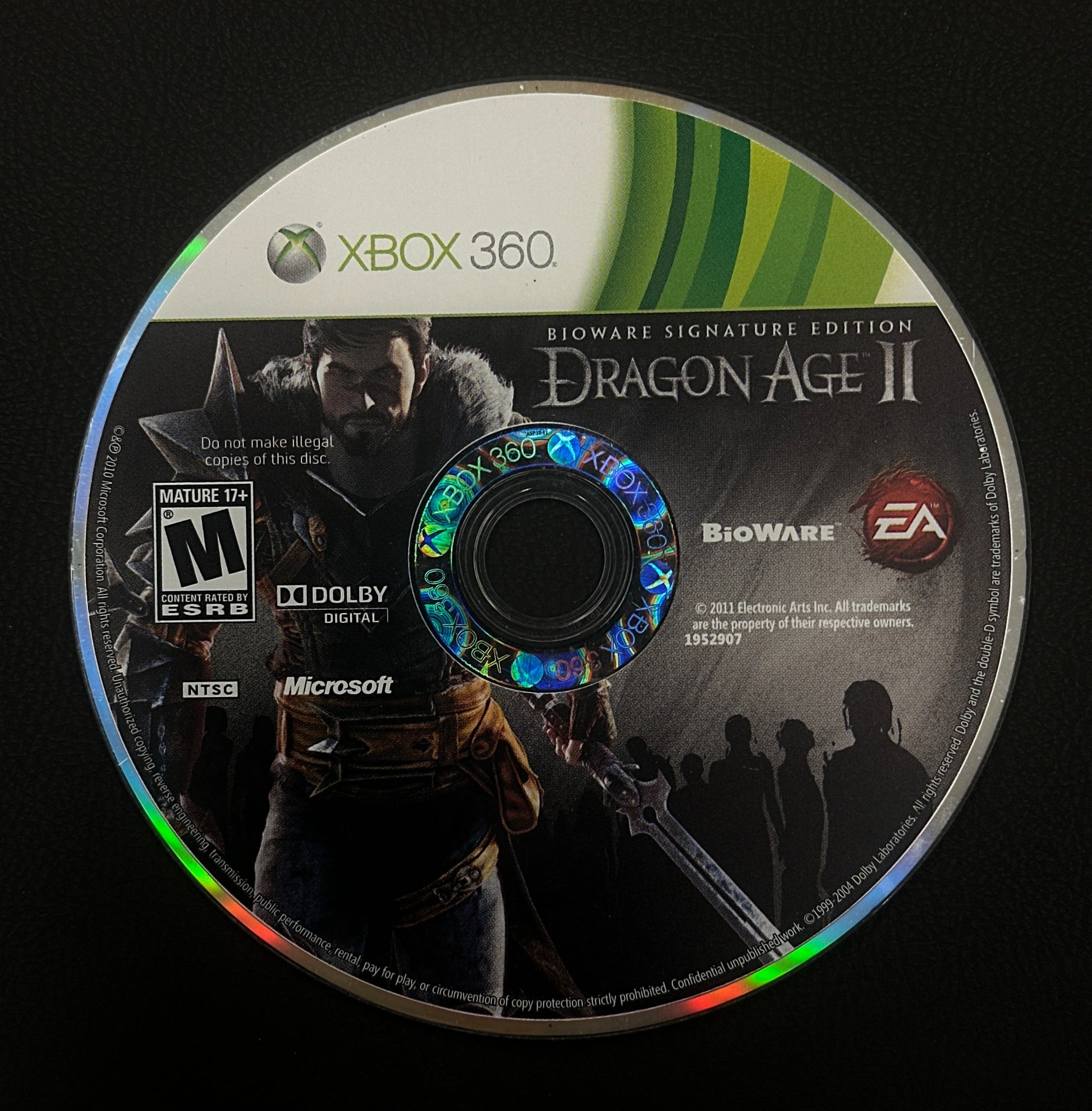 Dragon Age II game disc for Xbox 360 on a black background