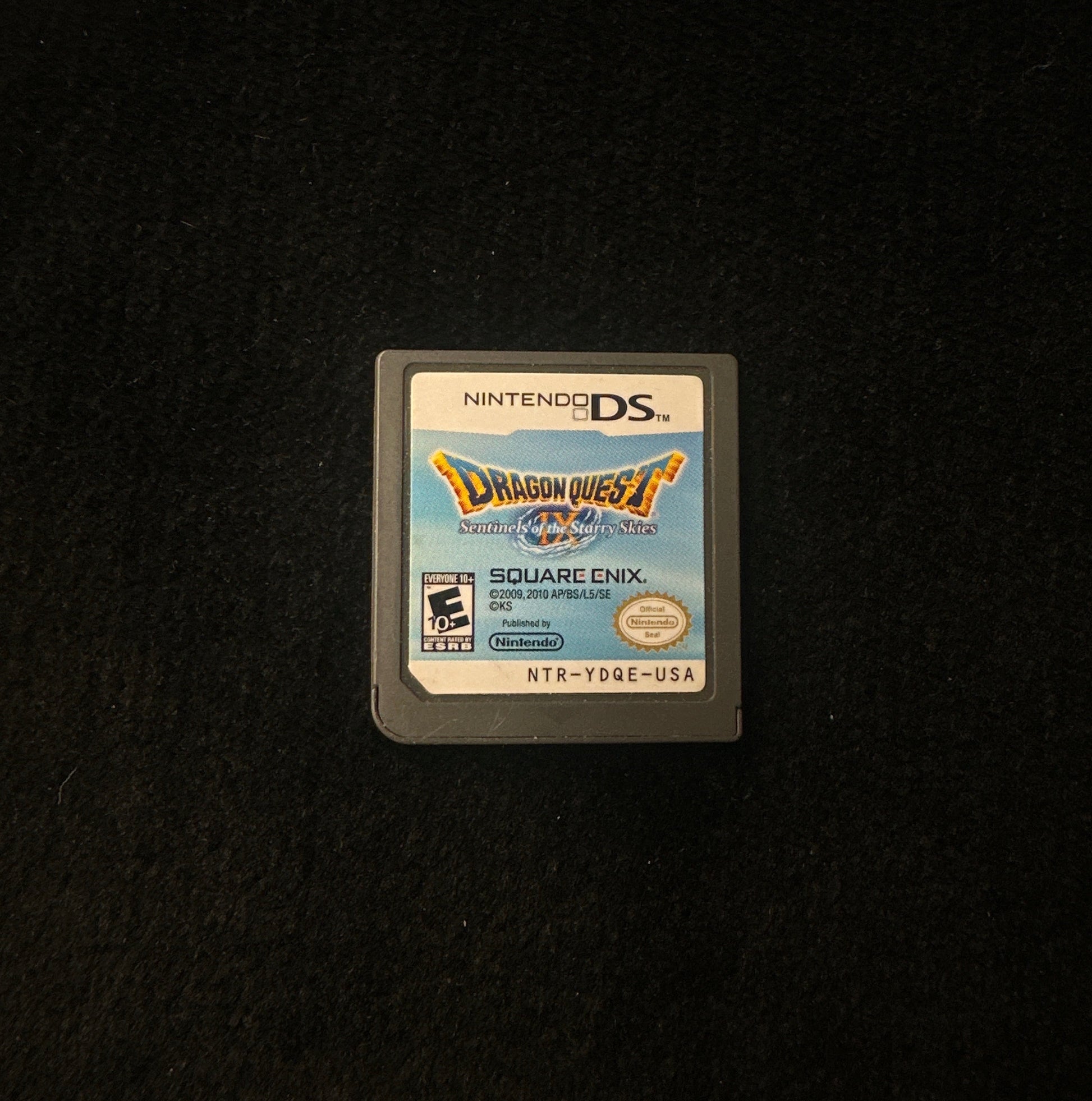 Nintendo DS game cartridge on a black background