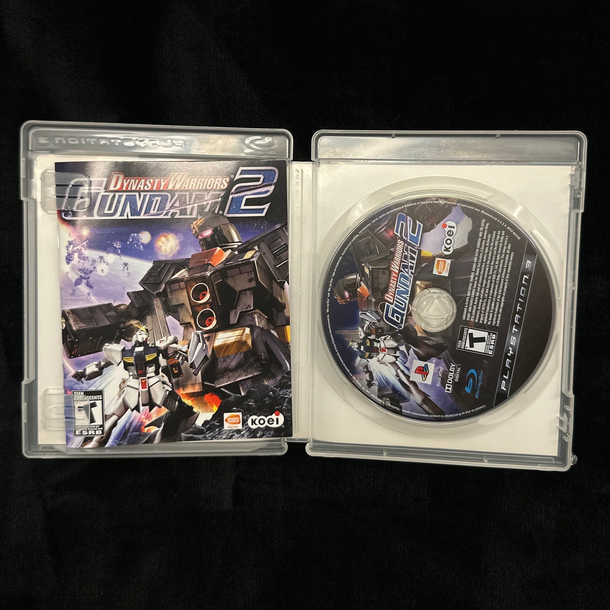 Game disc and case on a black background