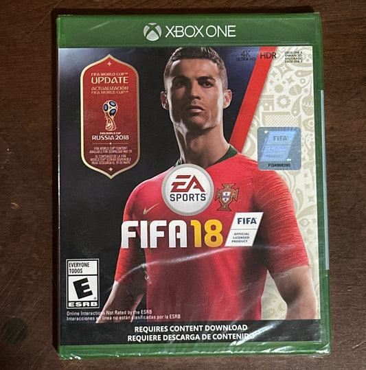 FIFA 18 video game case for Xbox One on a wooden surface