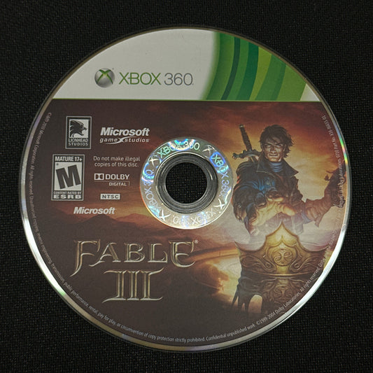 Game disc for 'Fable III' on an Xbox 360 console with a black background
