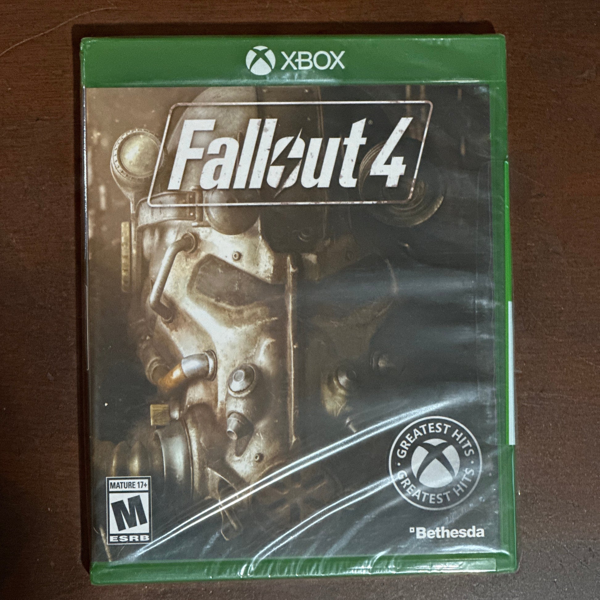 Xbox game case for 'Fallout 4' on a wooden surface